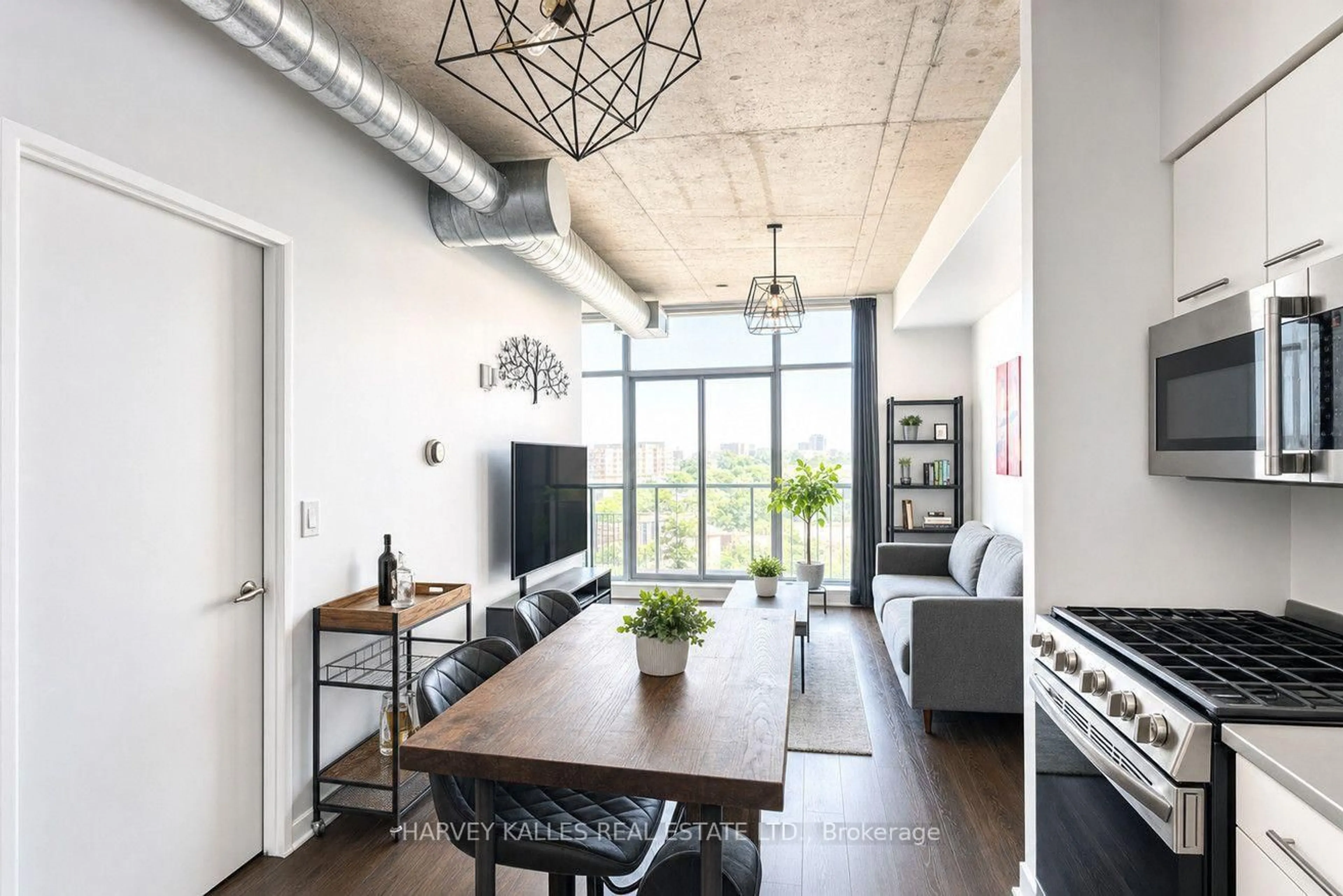 Living room with furniture, cement floor for 1375 Dupont St #403, Toronto Ontario M6H 4J8