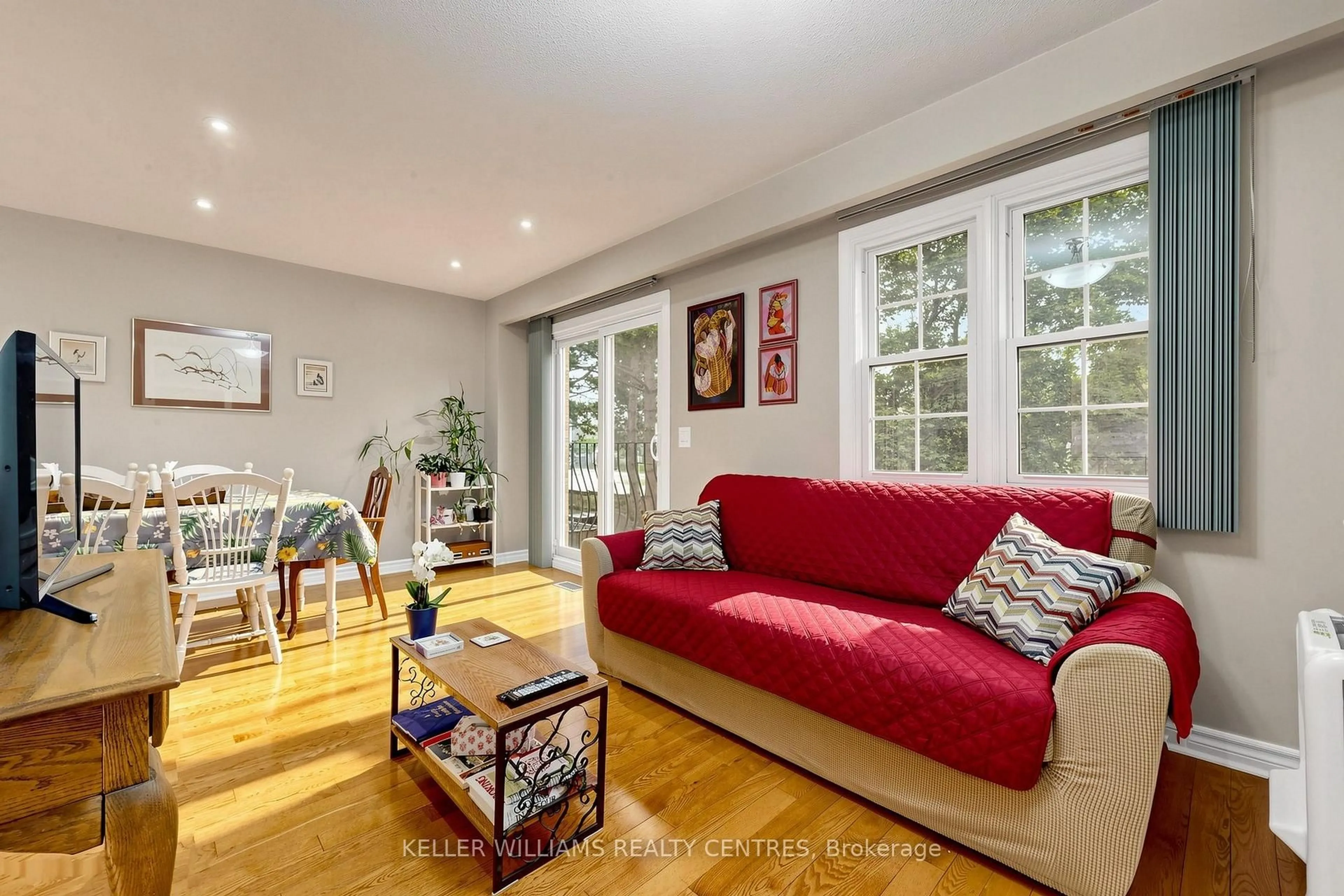 Living room with furniture, wood/laminate floor for 1951 Rathburn Rd #9, Mississauga Ontario L4W 2N9