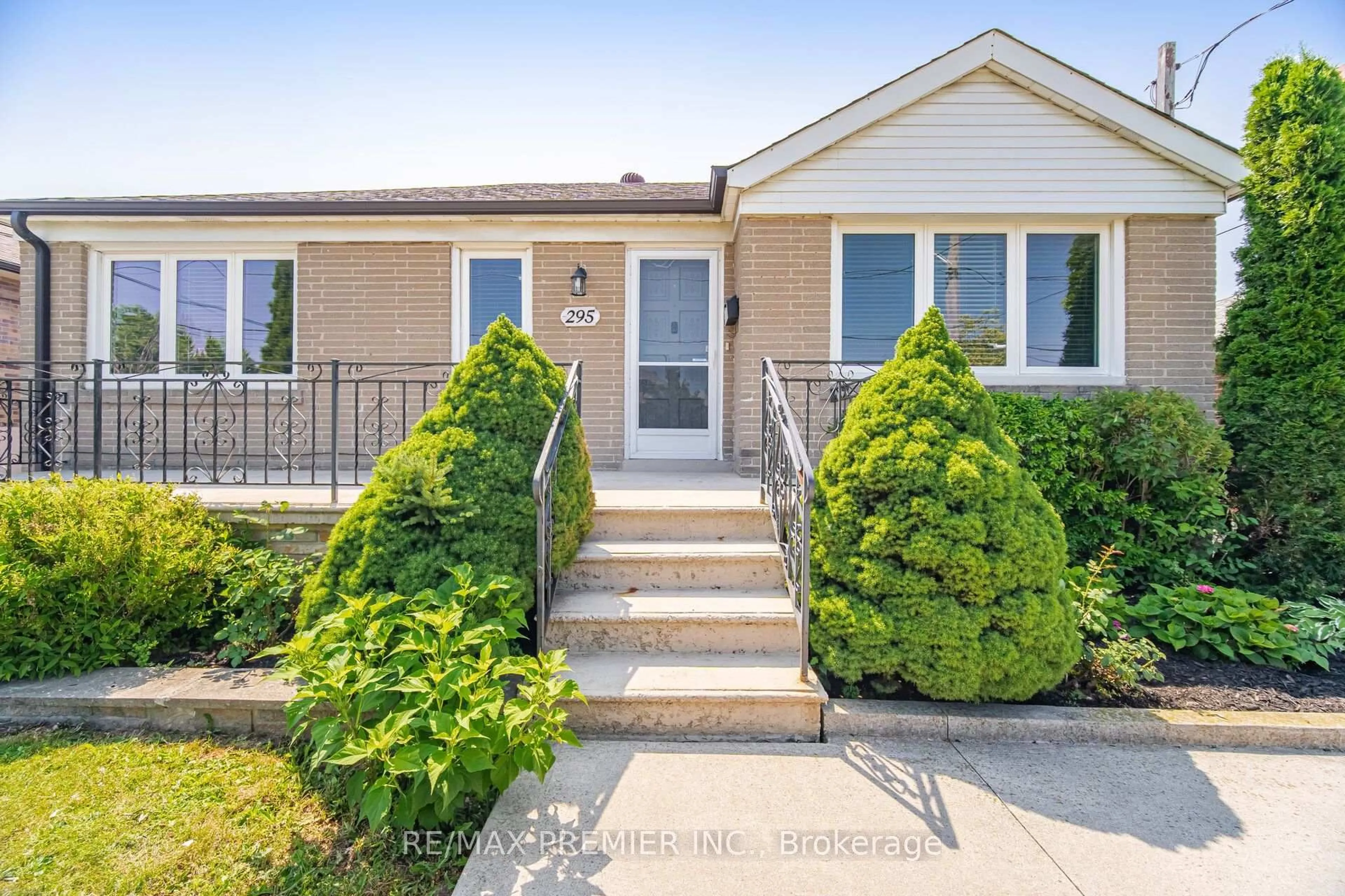 Home with vinyl exterior material, street for 295 Falstaff Ave, Toronto Ontario M6L 2G4