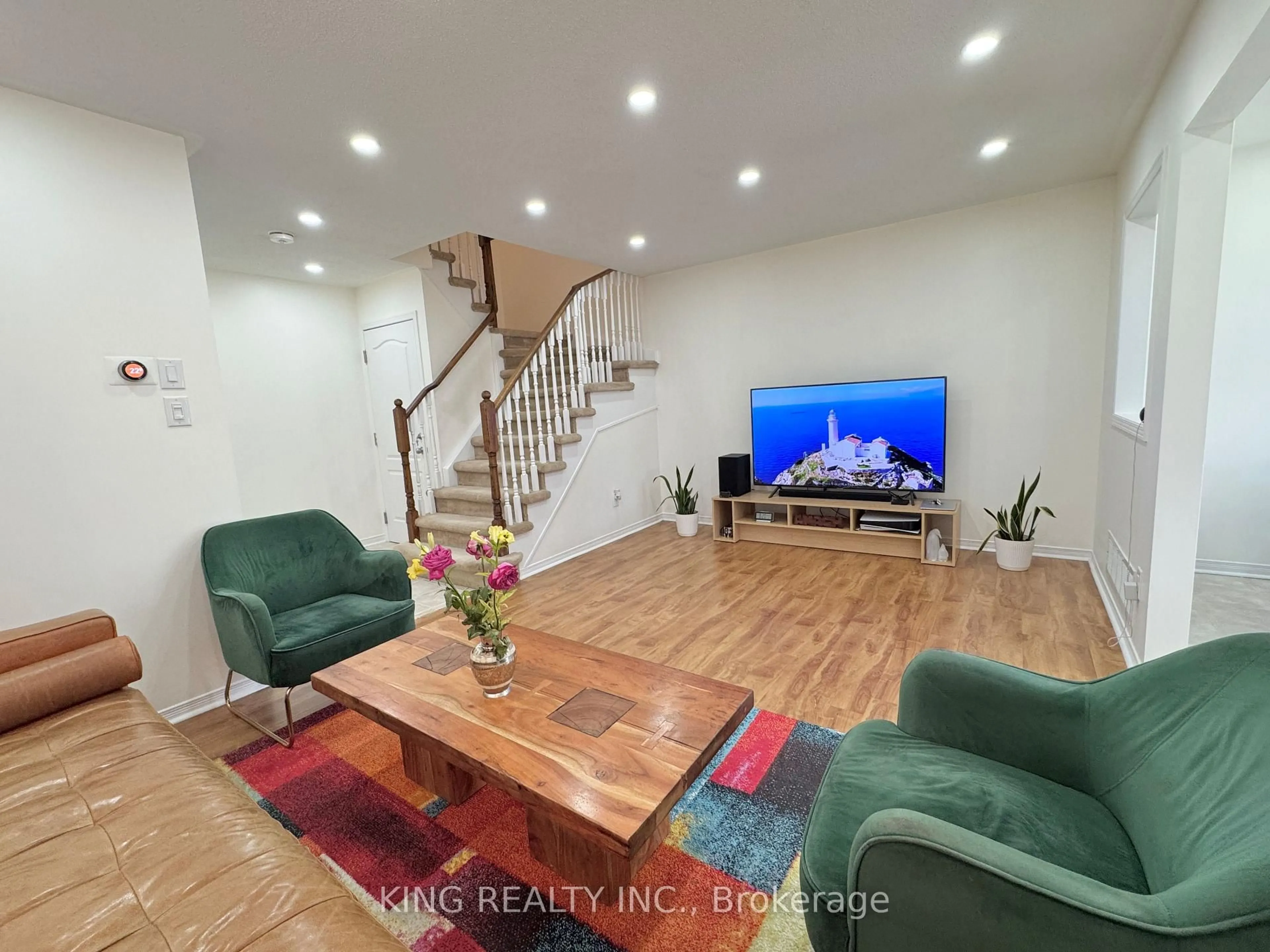 Living room with furniture, wood/laminate floor for 277 Morningmist St, Brampton Ontario L6R 2B9