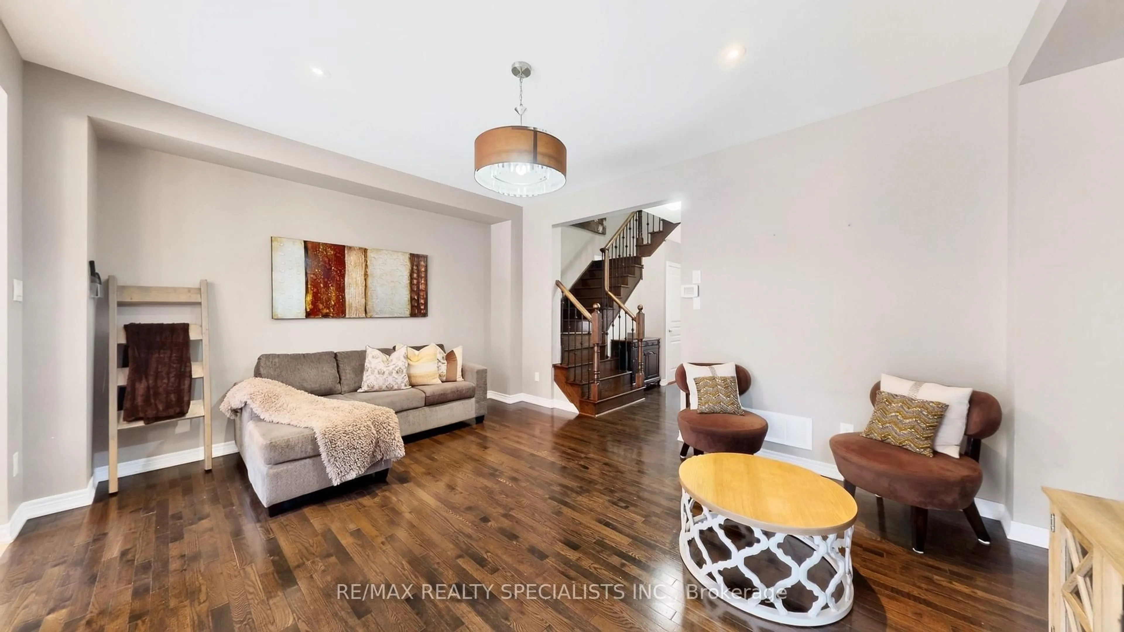 Living room with furniture, wood/laminate floor for 30 Pendulum Circ, Brampton Ontario L6R 3N6