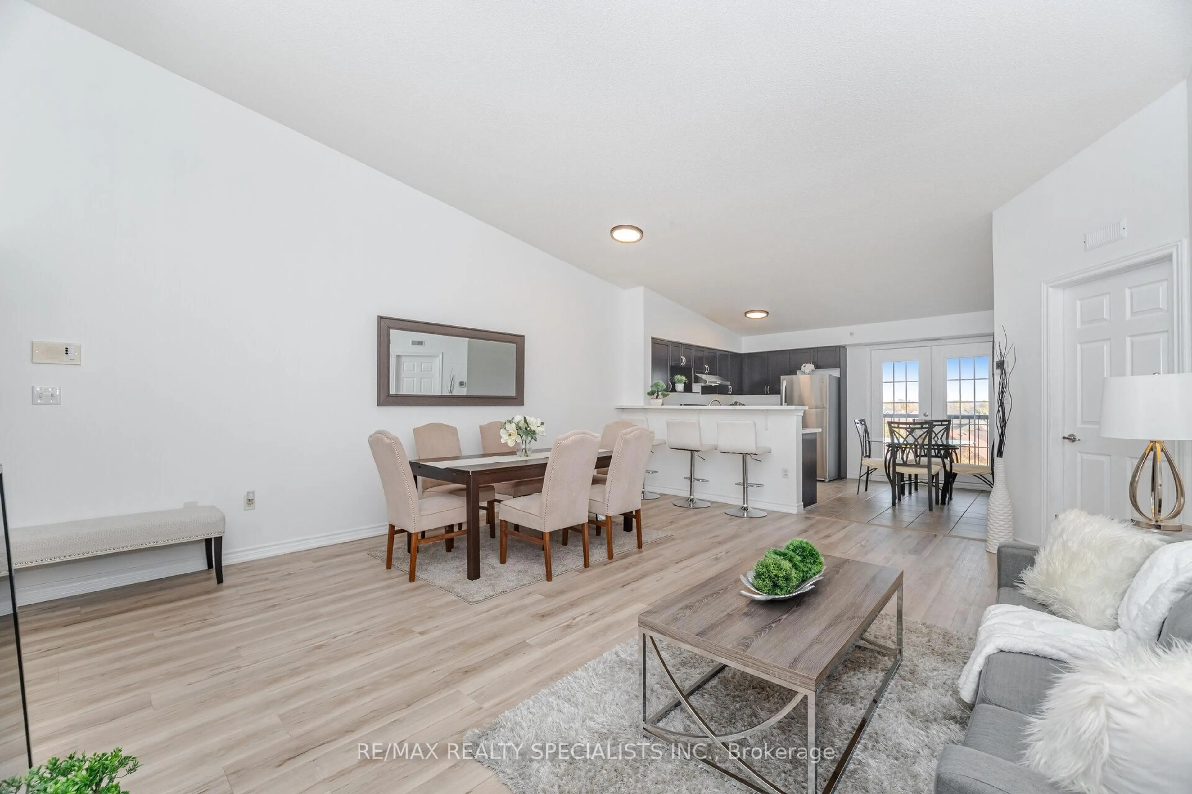 Open concept kitchen, wood/laminate floor for 1350 Main St #412, Milton Ontario L9T 0R3