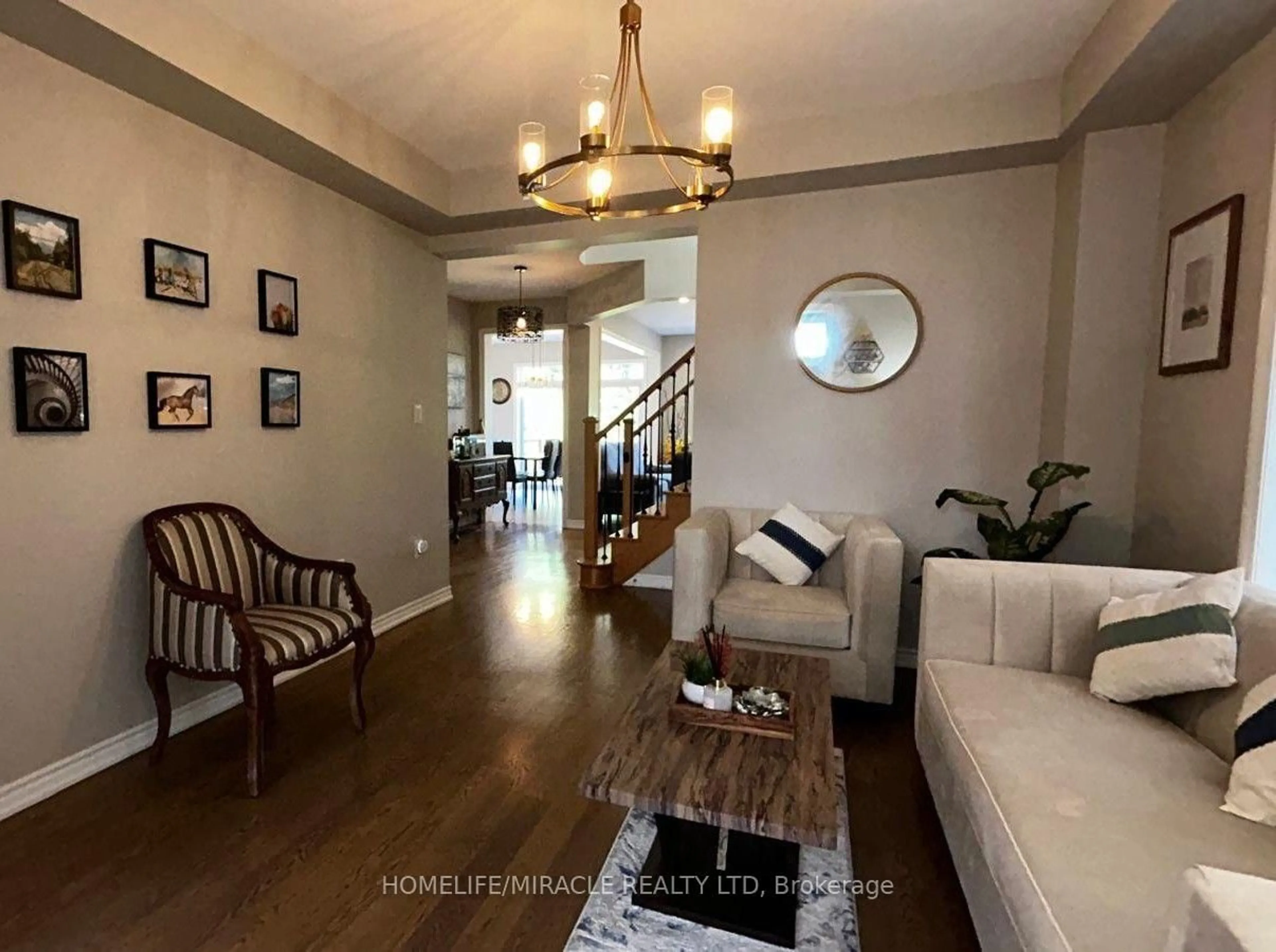 Living room with furniture, unknown for 185 Thornbush Blvd, Brampton Ontario L7A 4R5
