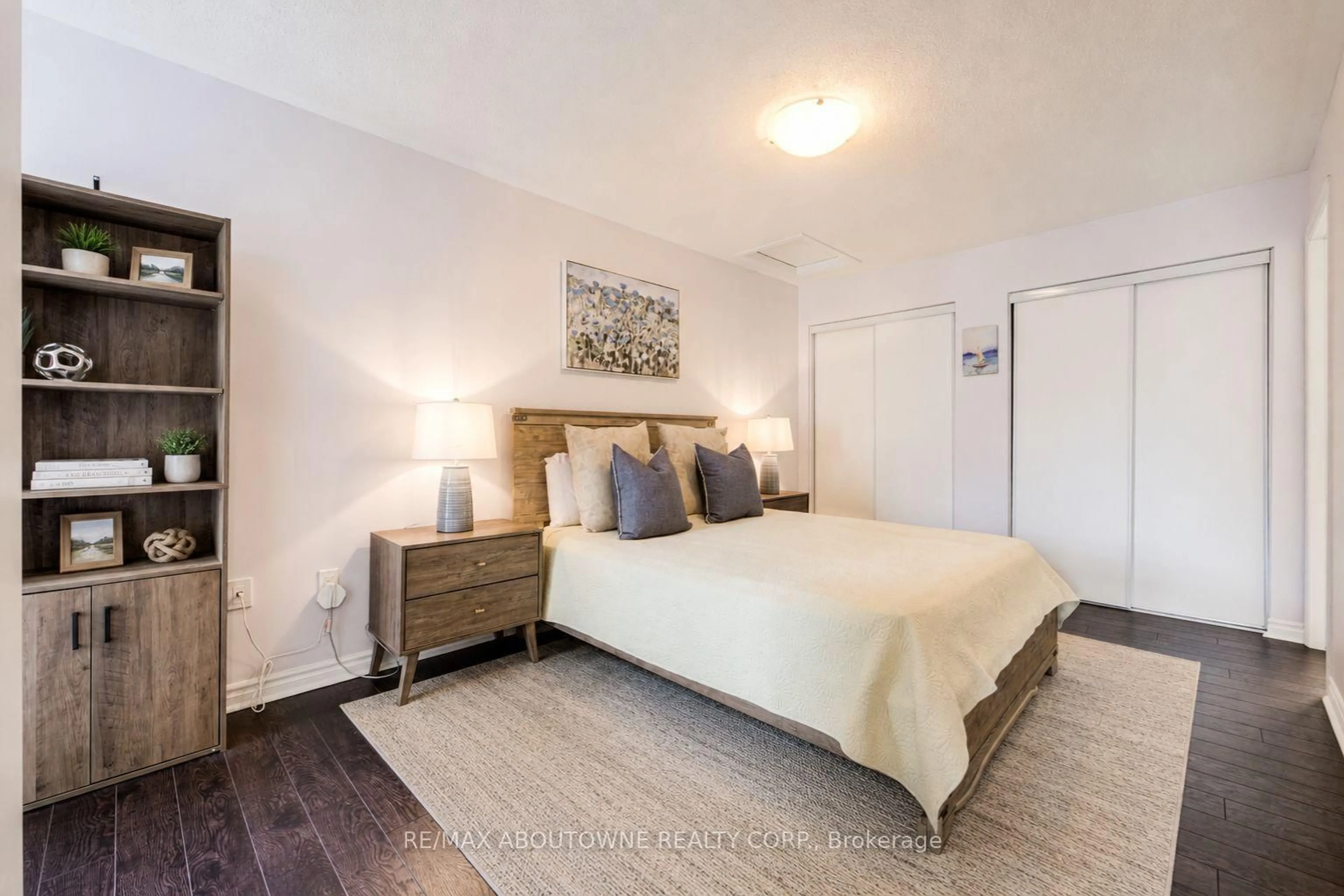 Bedroom with bed, wood/laminate floor for 1000 Asleton Blvd #58, Milton Ontario L9T 9L6