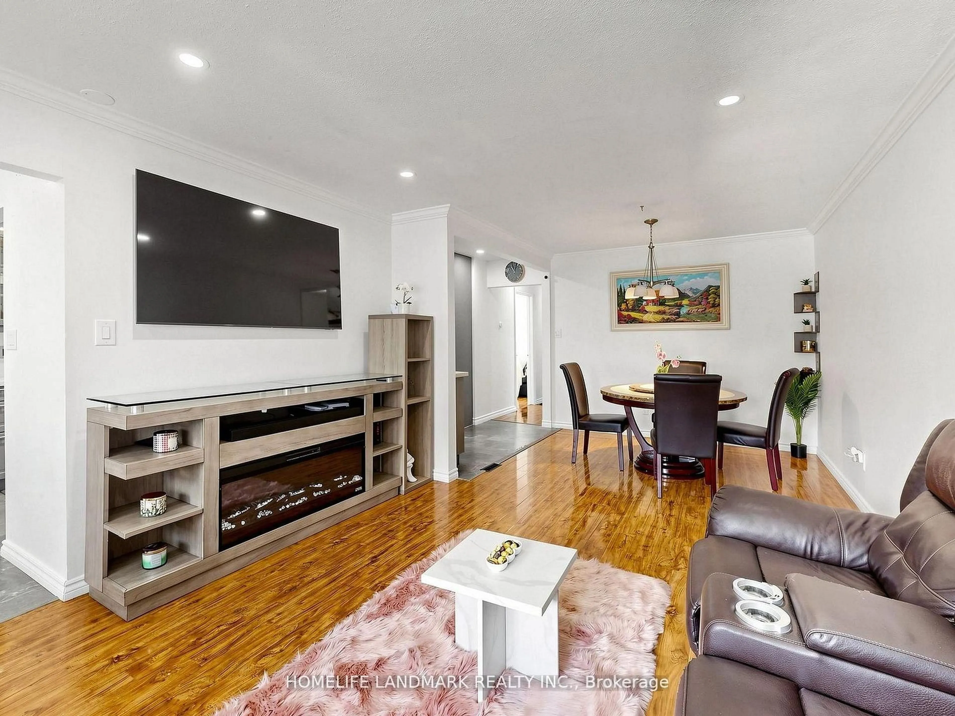 Living room with furniture, wood/laminate floor for 42 Glenmore Cres, Brampton Ontario L6S 1H8