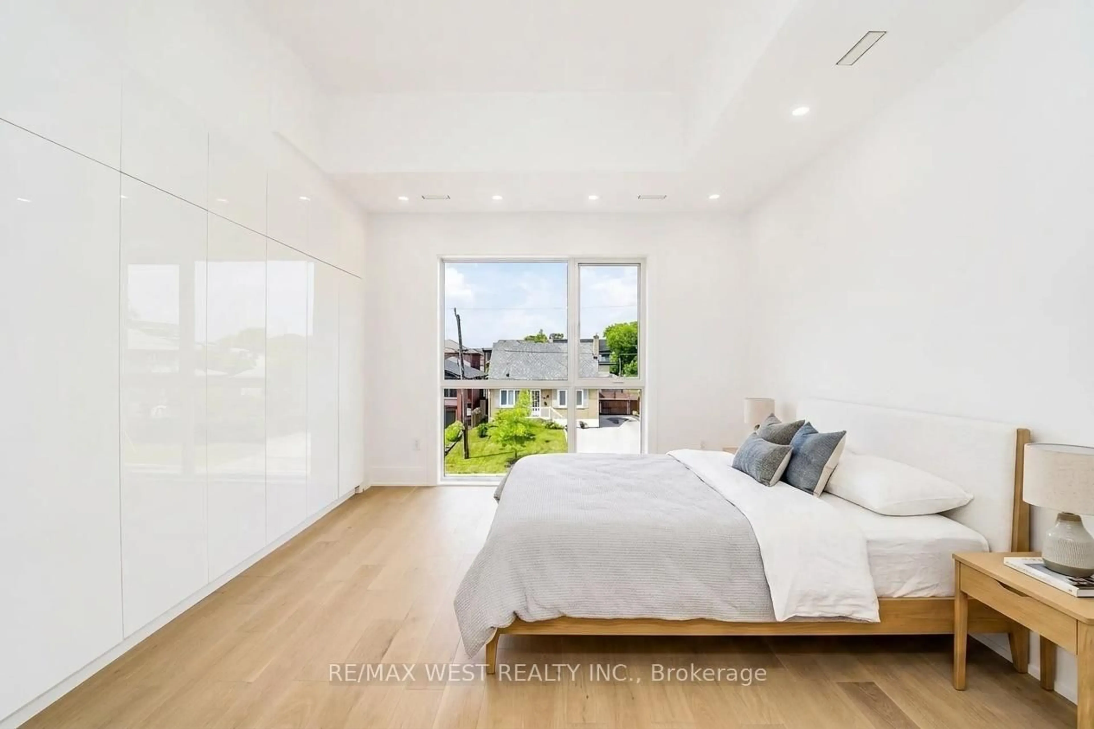 Bedroom with bed, wood/laminate floor for 53 Celt Ave, Toronto Ontario M6A 1H2