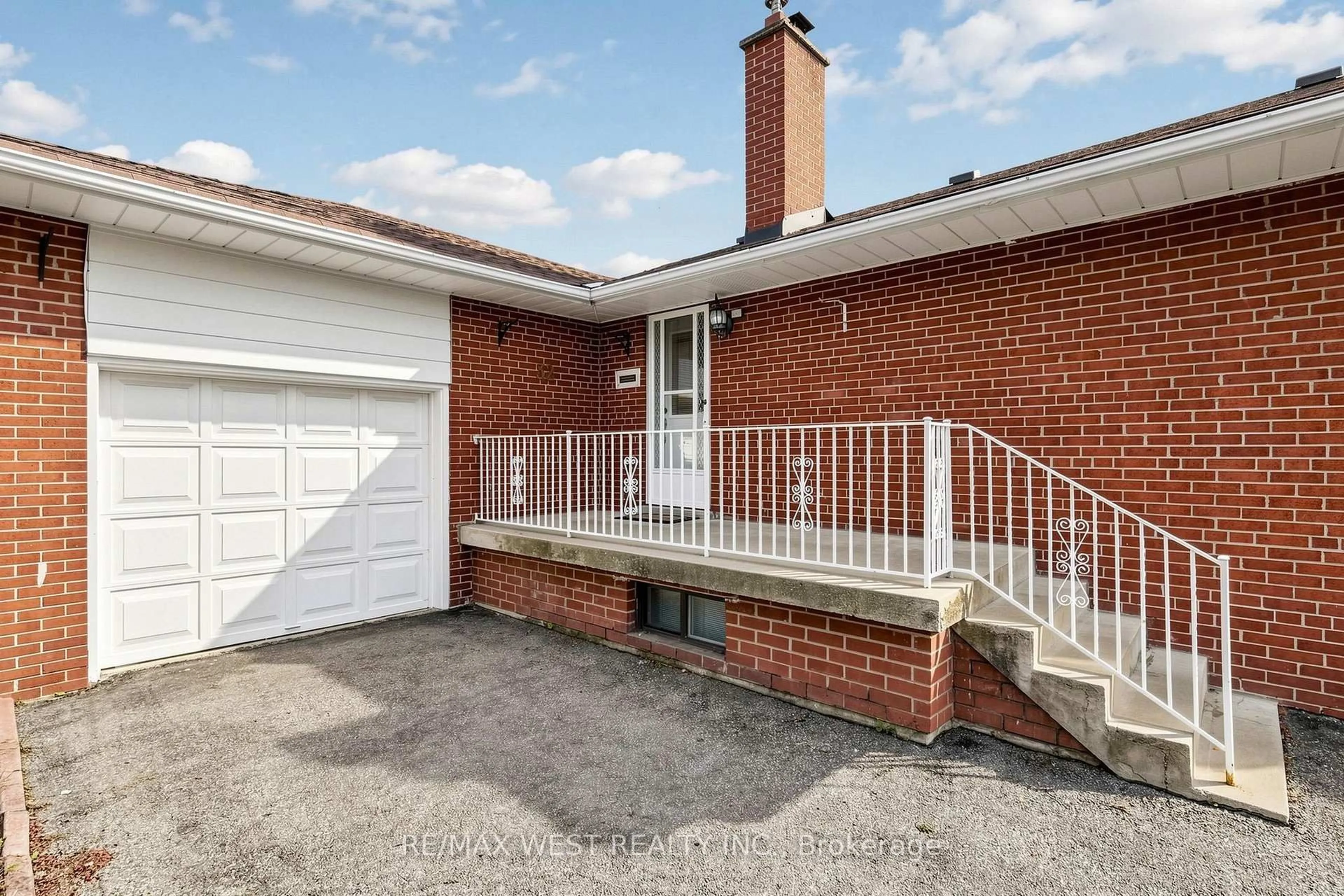 Home with brick exterior material, street for 32 Allonsius Dr, Toronto Ontario M9C 3N5