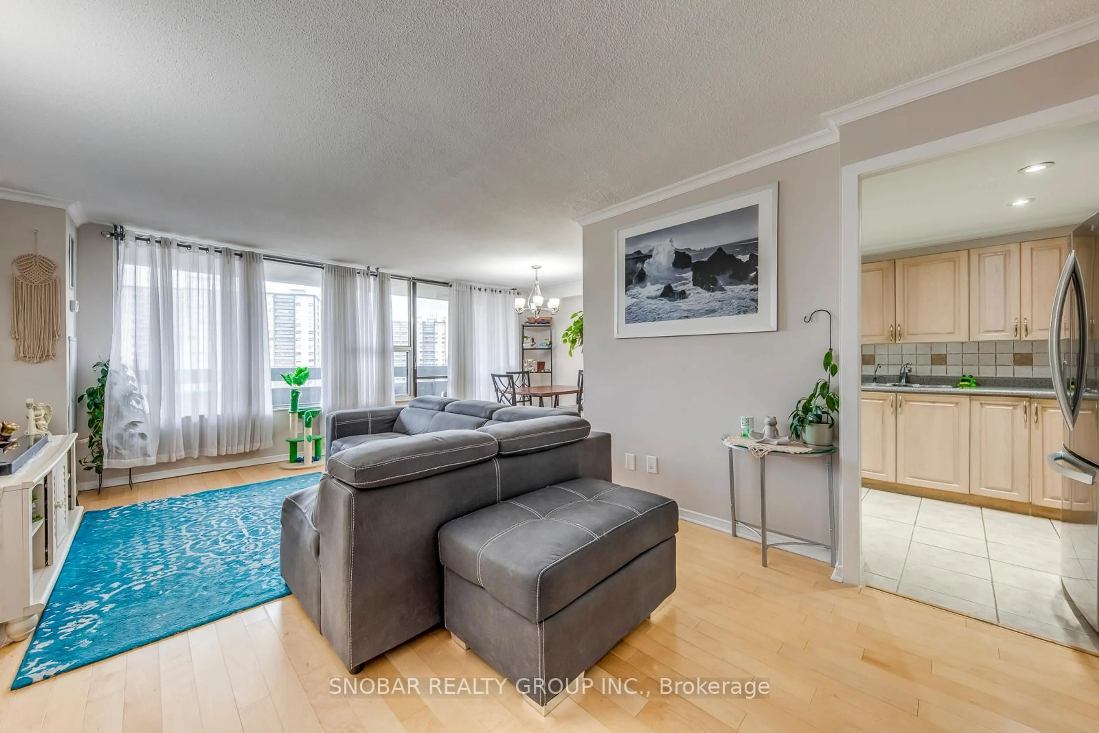Living room with furniture, unknown for 11 Wincott Dr #810, Toronto Ontario M9R 2R9