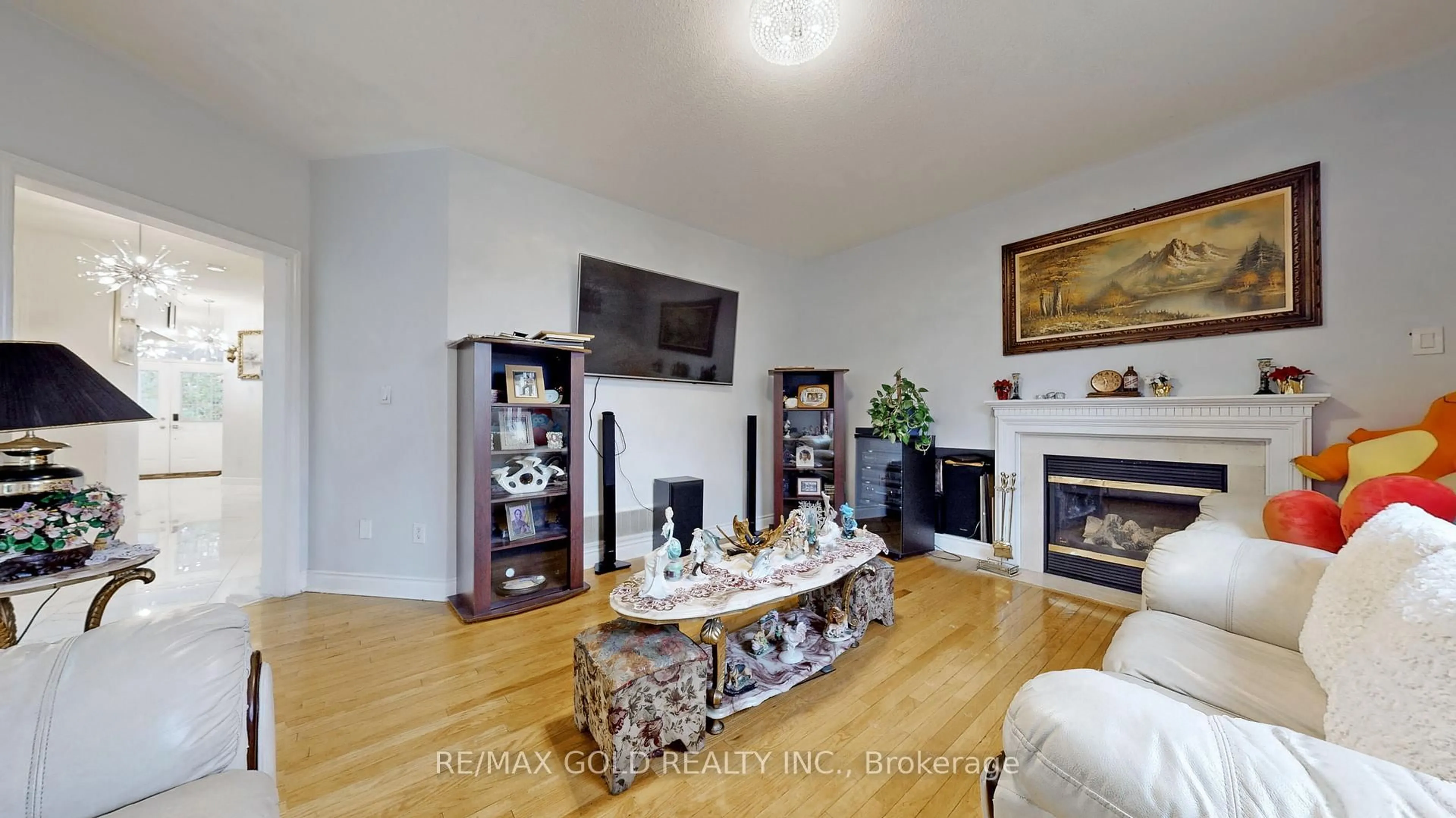 Living room with furniture, wood/laminate floor for 64 Prue Crt, Brampton Ontario L6P 1P8