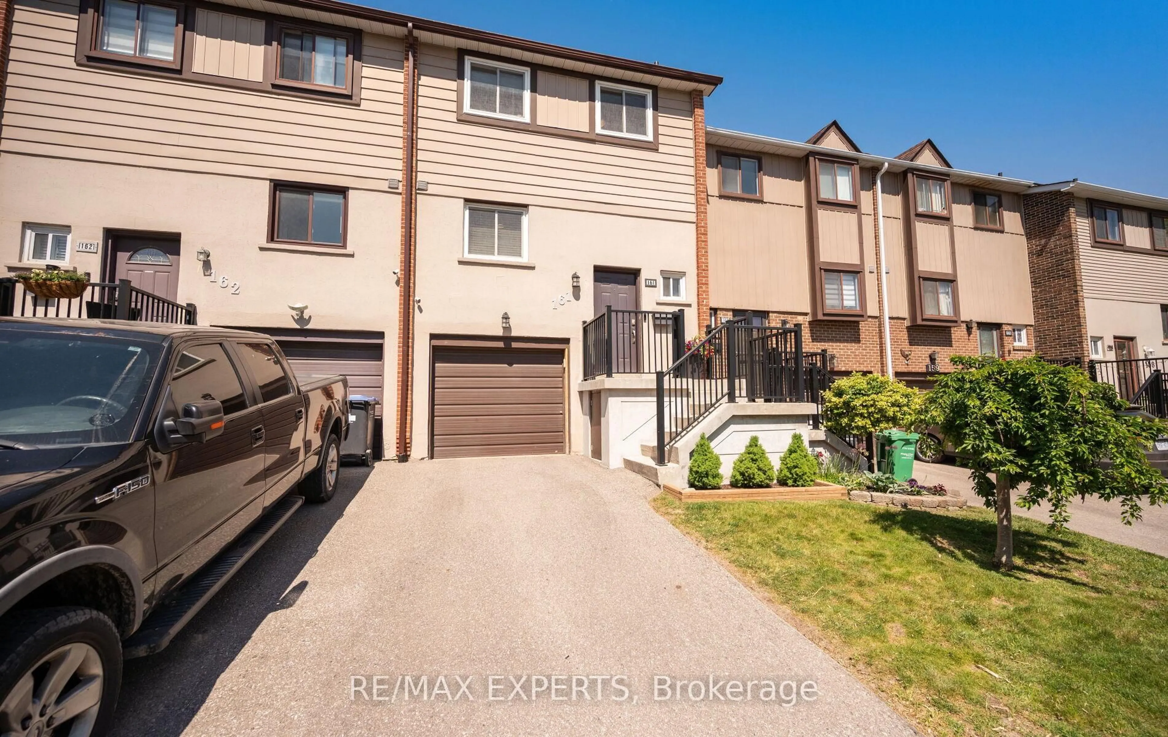 A pic from outside/outdoor area/front of a property/back of a property/a pic from drone, street for 161 Moregate Cres #15, Brampton Ontario L6S 3K9