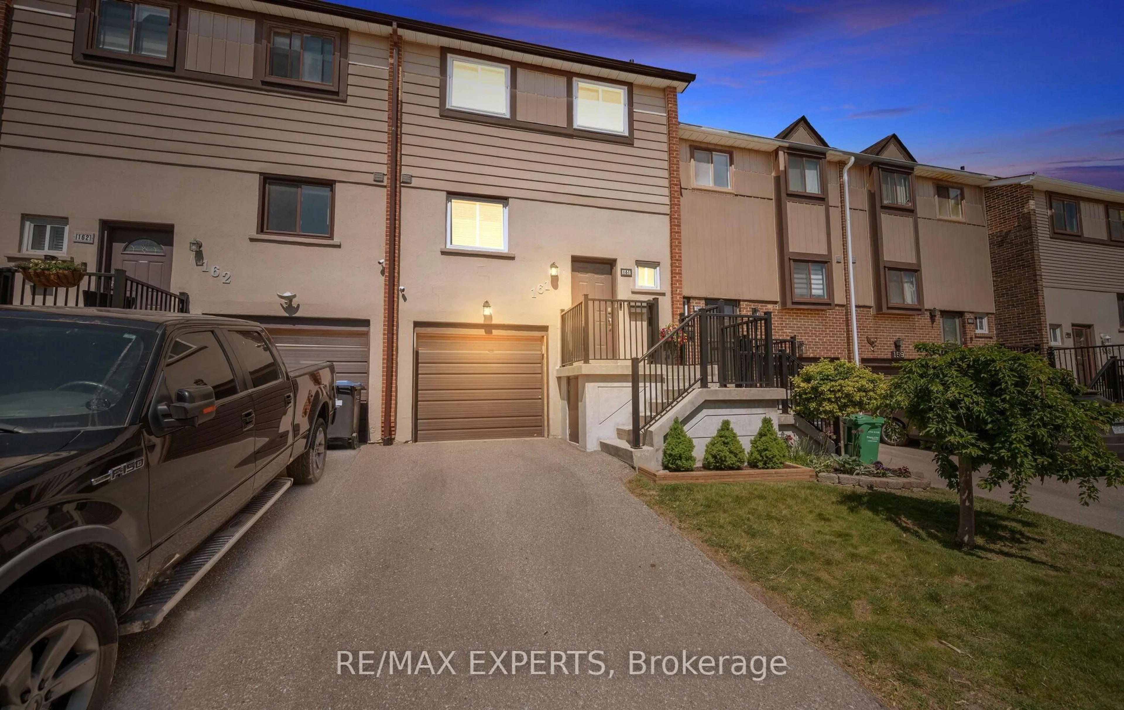 A pic from outside/outdoor area/front of a property/back of a property/a pic from drone, street for 161 Moregate Cres #15, Brampton Ontario L6S 3K9