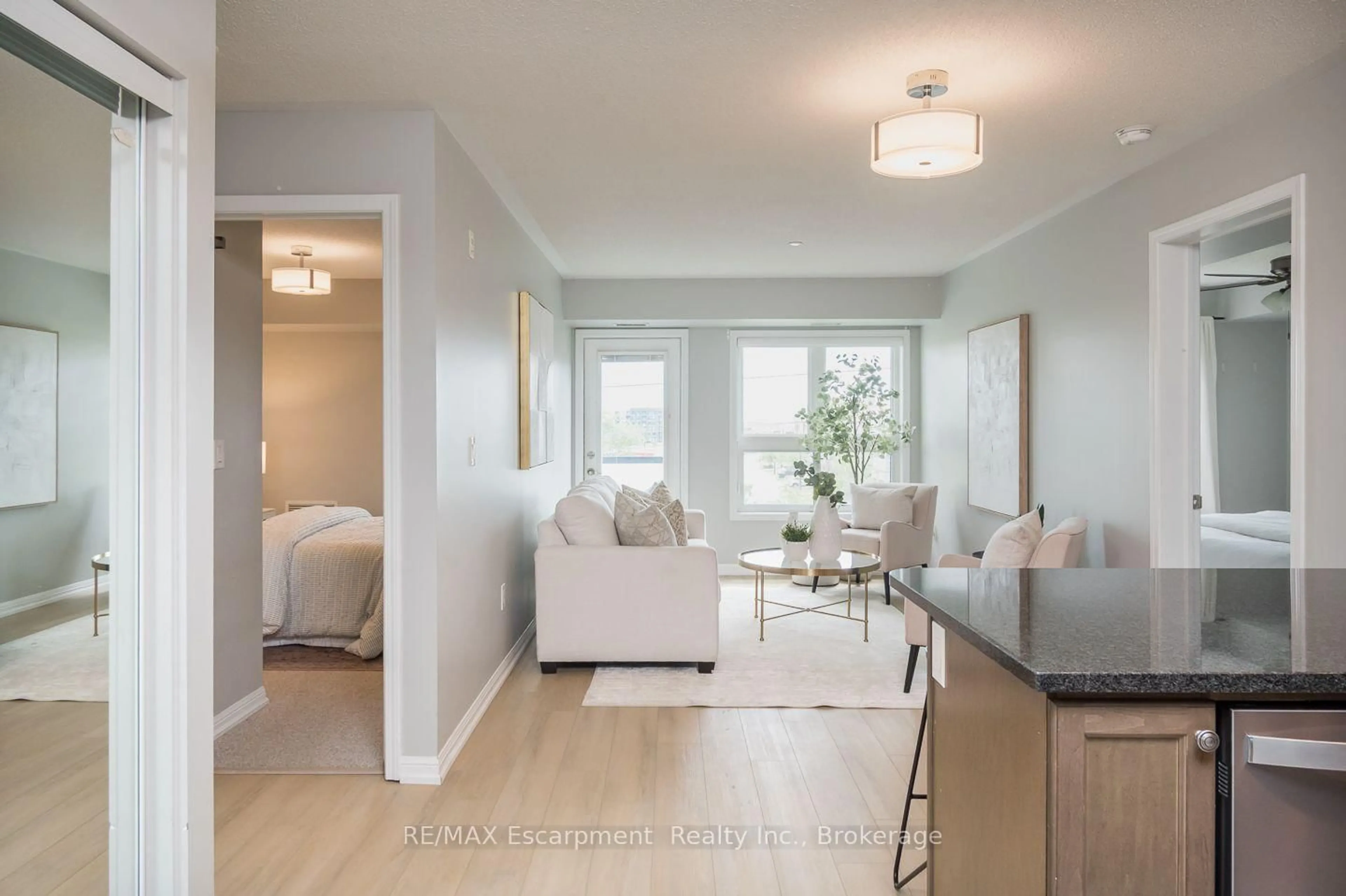 Living room with furniture, unknown for 1045 Nadalin Hts #307, Milton Ontario L9T 8R5