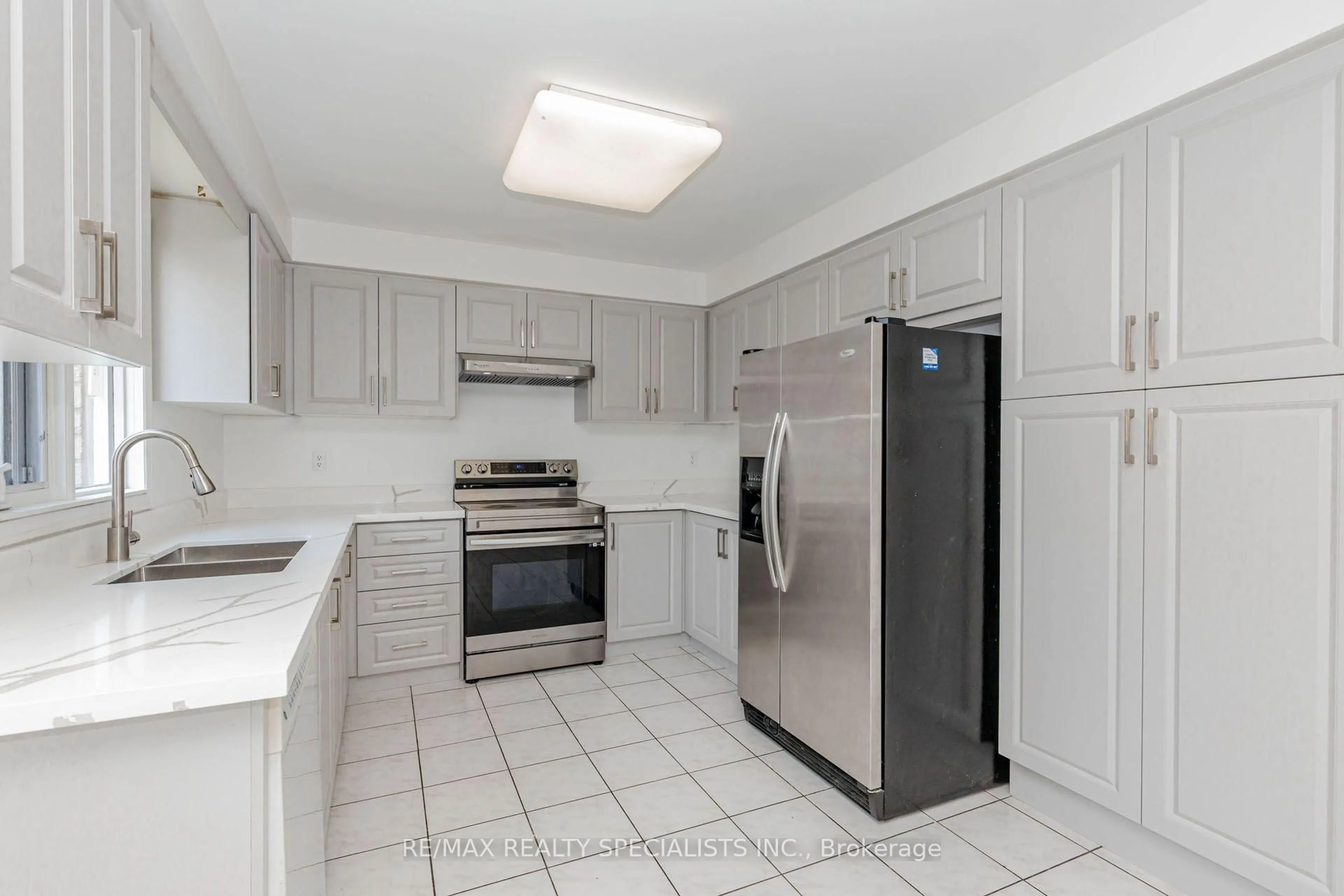 Standard kitchen, ceramic/tile floor for 64 Dolphin Song Cres, Brampton Ontario L6R 2A7