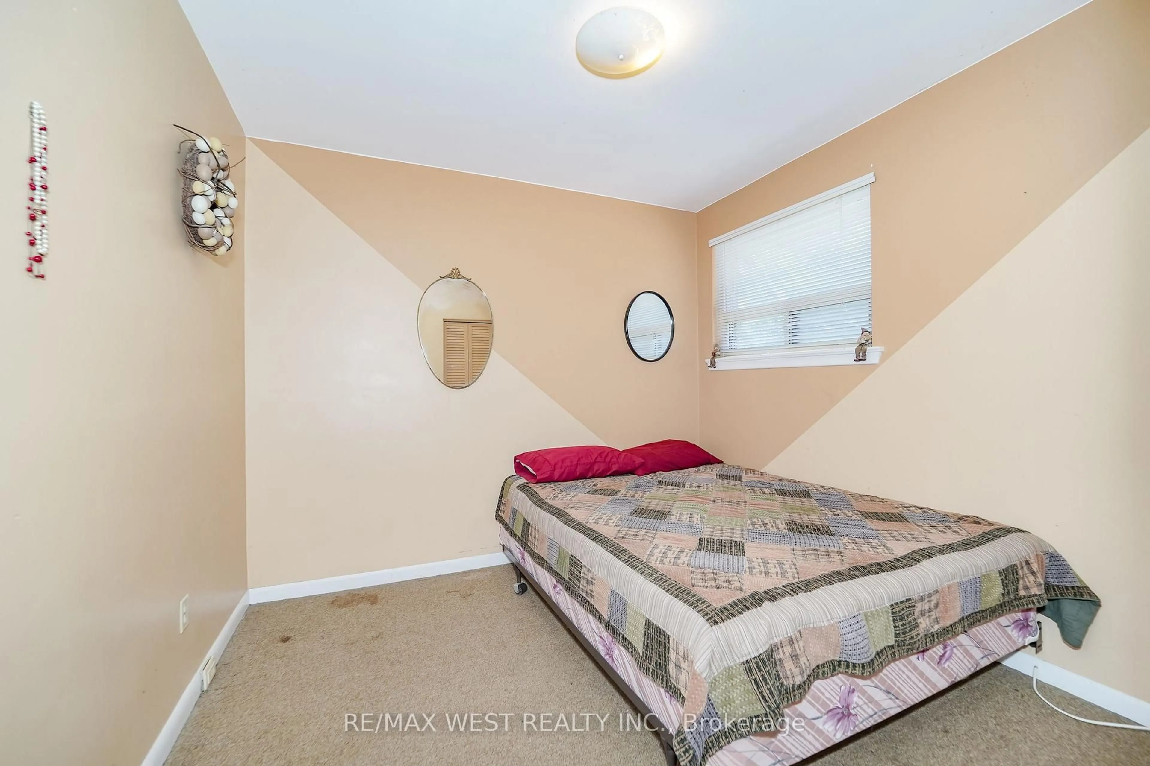 Bedroom with bed, carpet floor for 18 Mcclure Ave, Brampton Ontario L6X 2E3