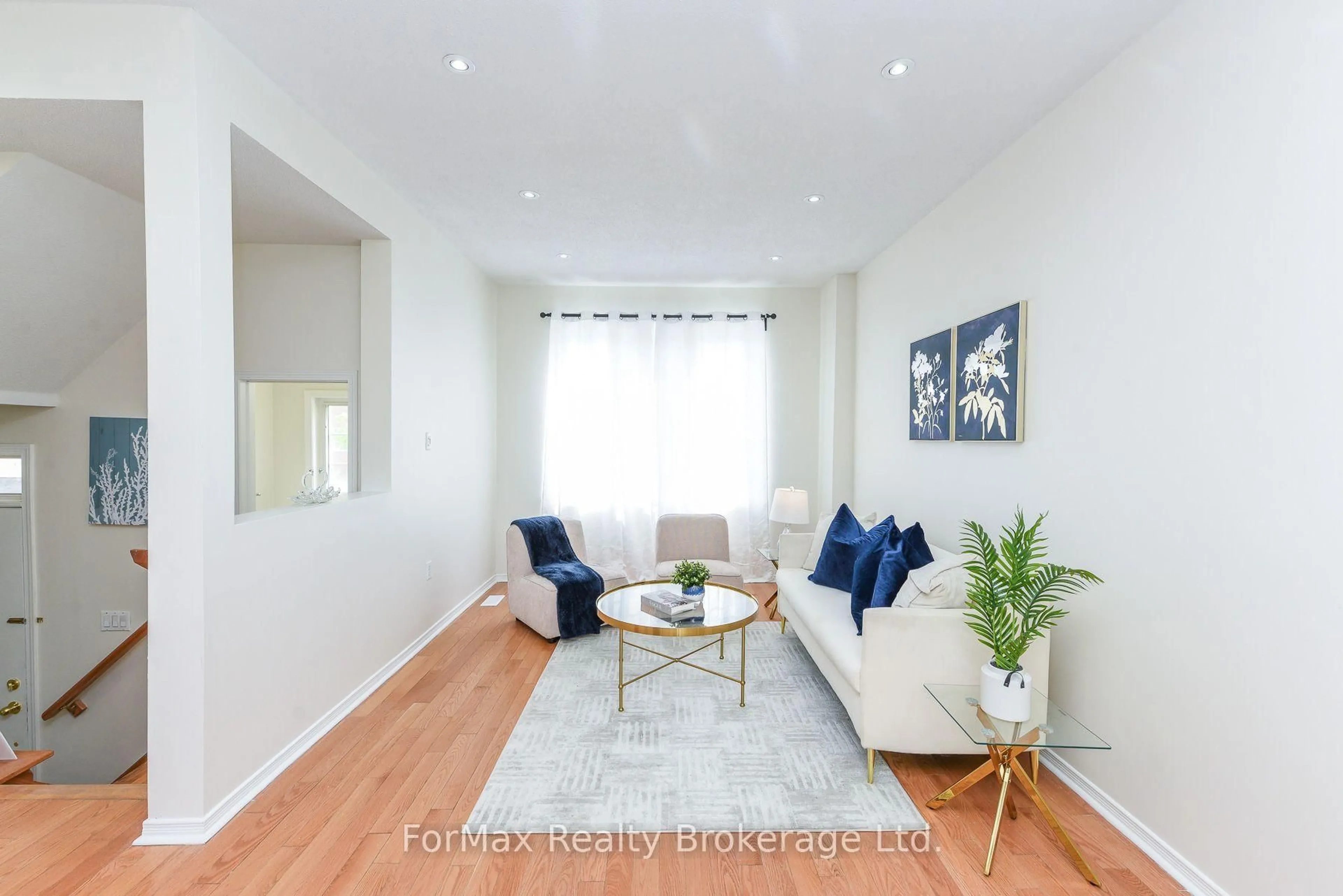 Living room with furniture, wood/laminate floor for 7155 Magistrate Terr #145, Mississauga Ontario L5W 1Y9