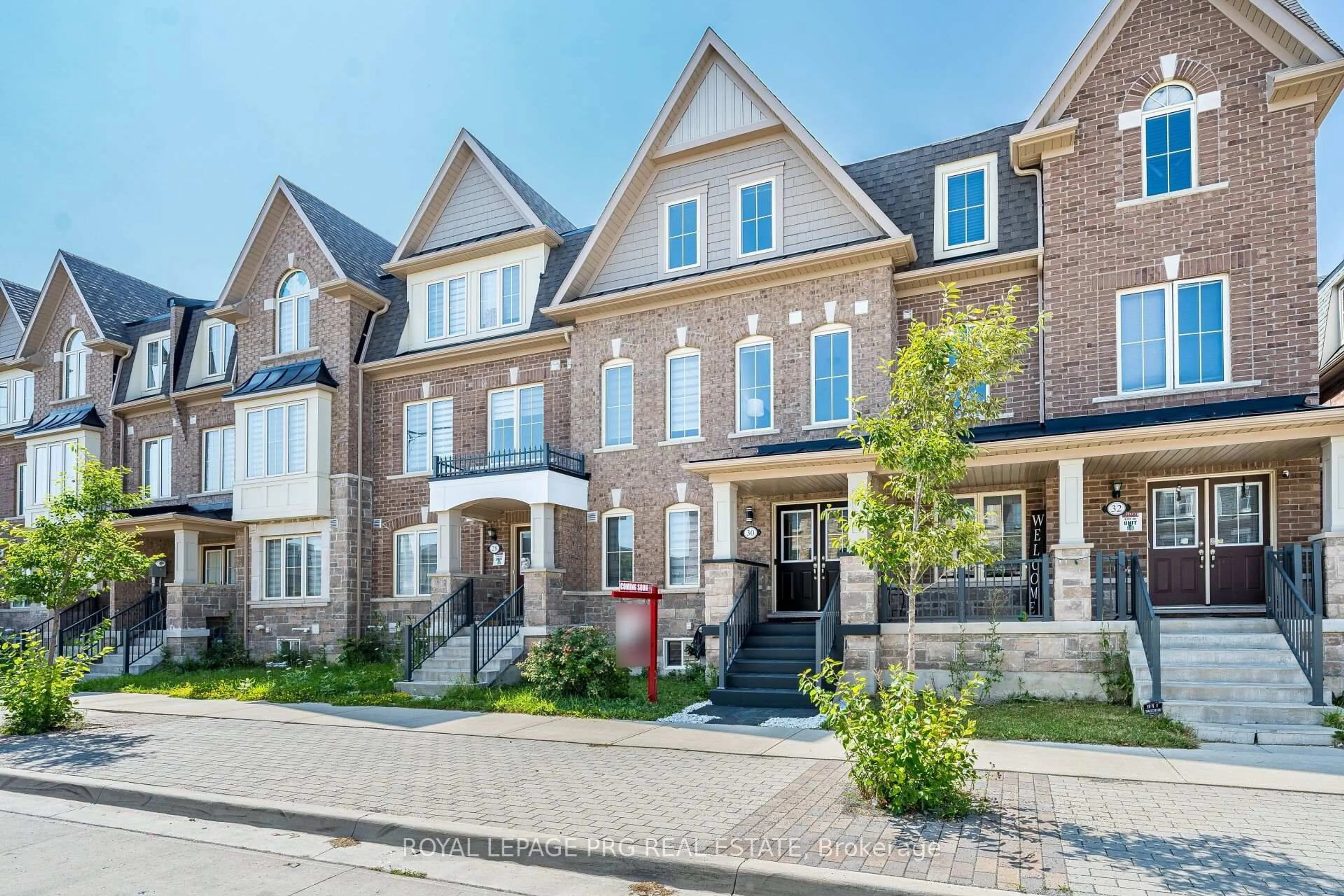Home with brick exterior material, street for 30 Remembrance Rd, Brampton Ontario L7A 4Y8
