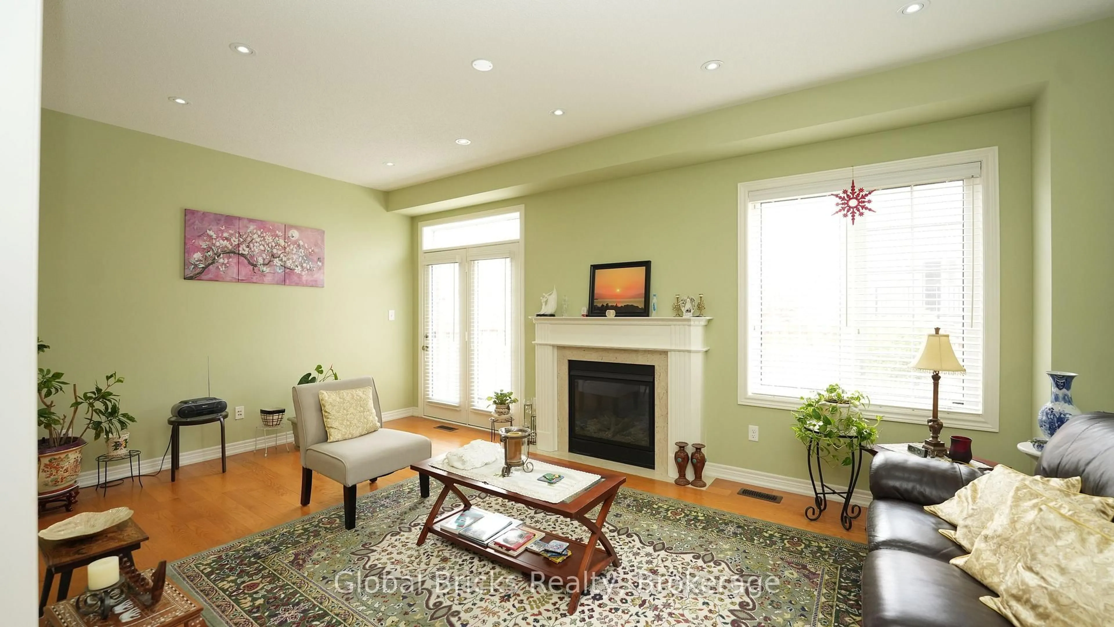 Living room with furniture, wood/laminate floor for 3428 Stoney Cres, Mississauga Ontario L5M 0N7