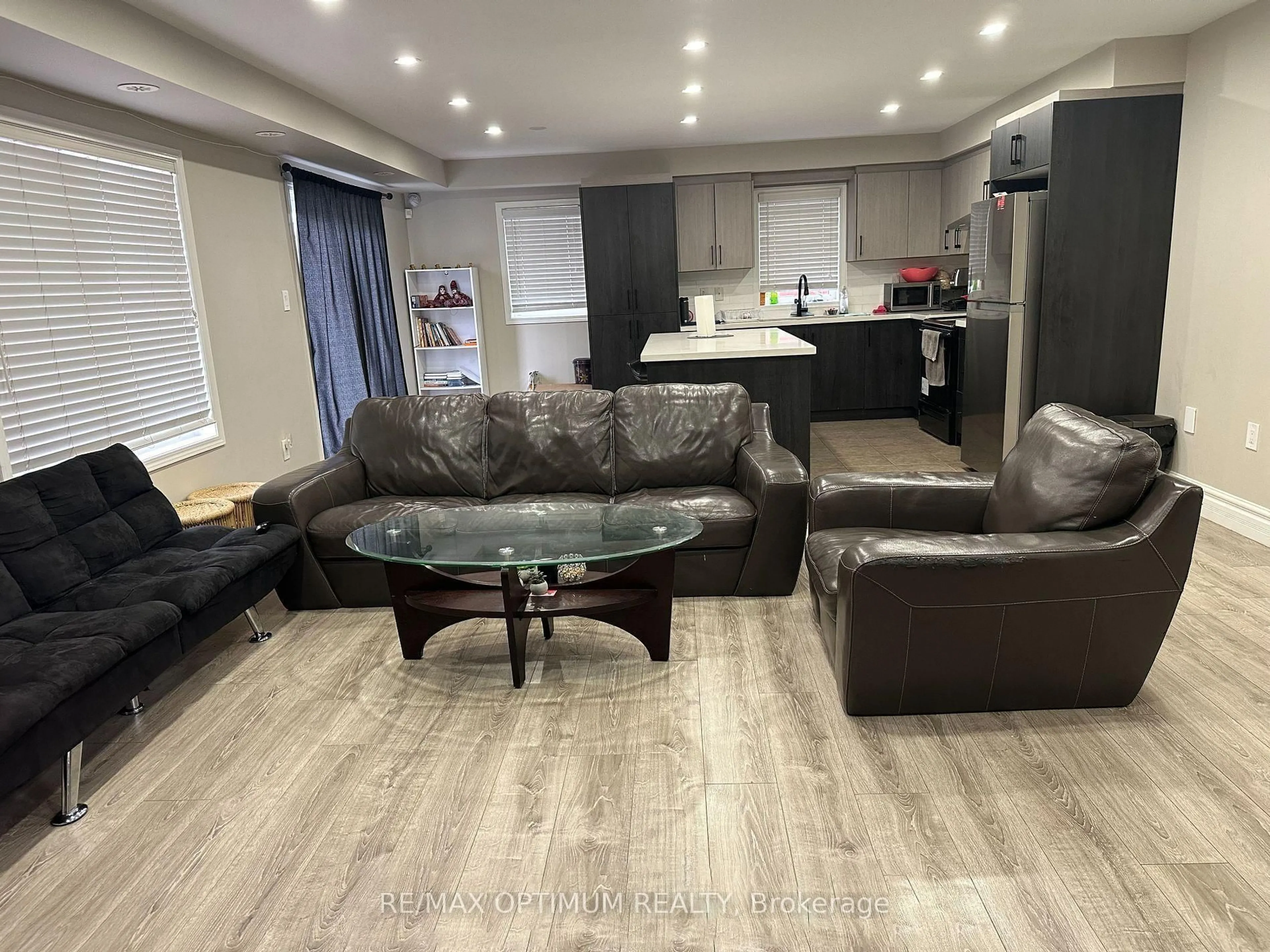 Living room with furniture, wood/laminate floor for 50 Baycliffe Cres, Brampton Ontario L7A 0S5