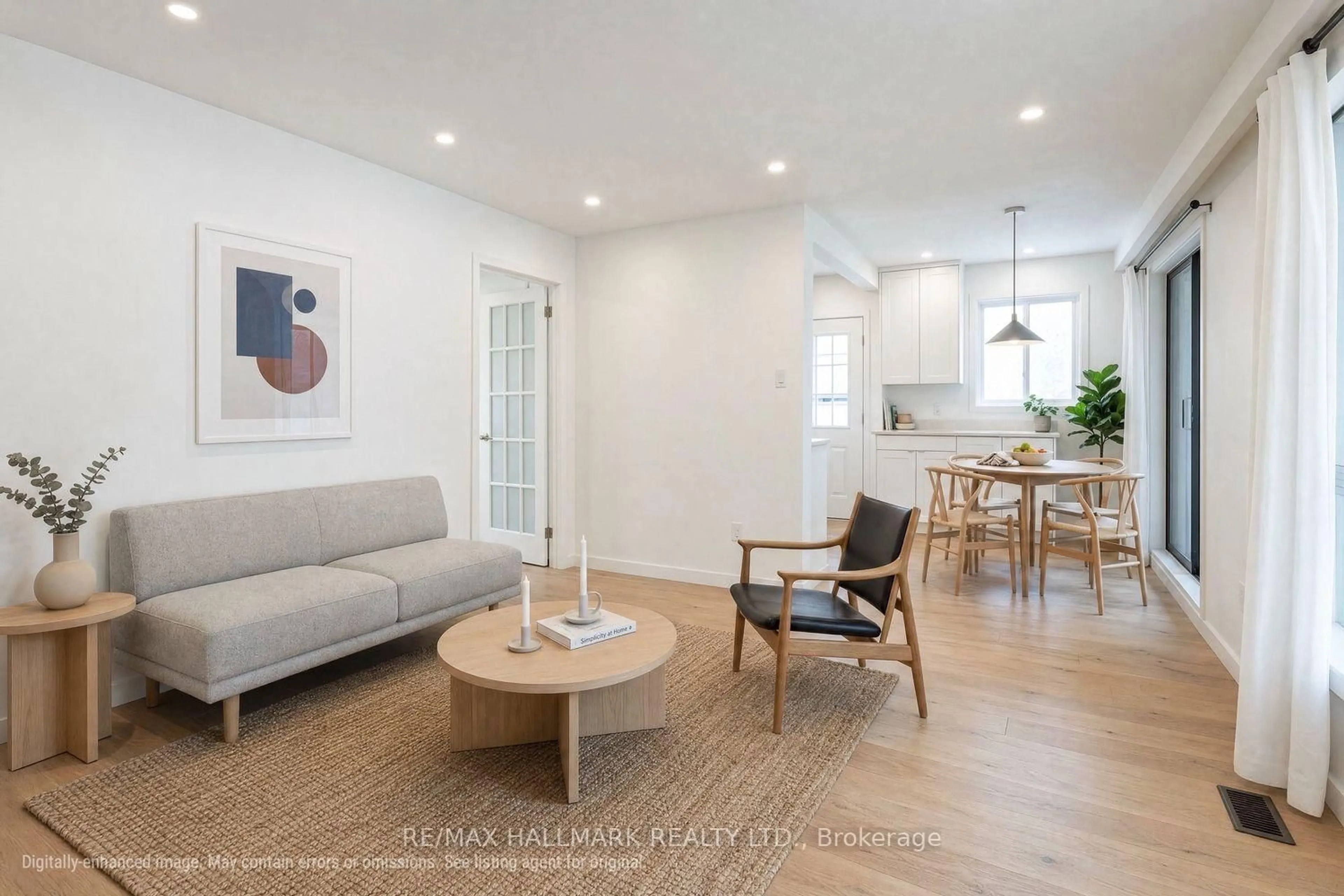 Living room with furniture, wood/laminate floor for 26 Flowertown Ave, Brampton Ontario L6X 2K2