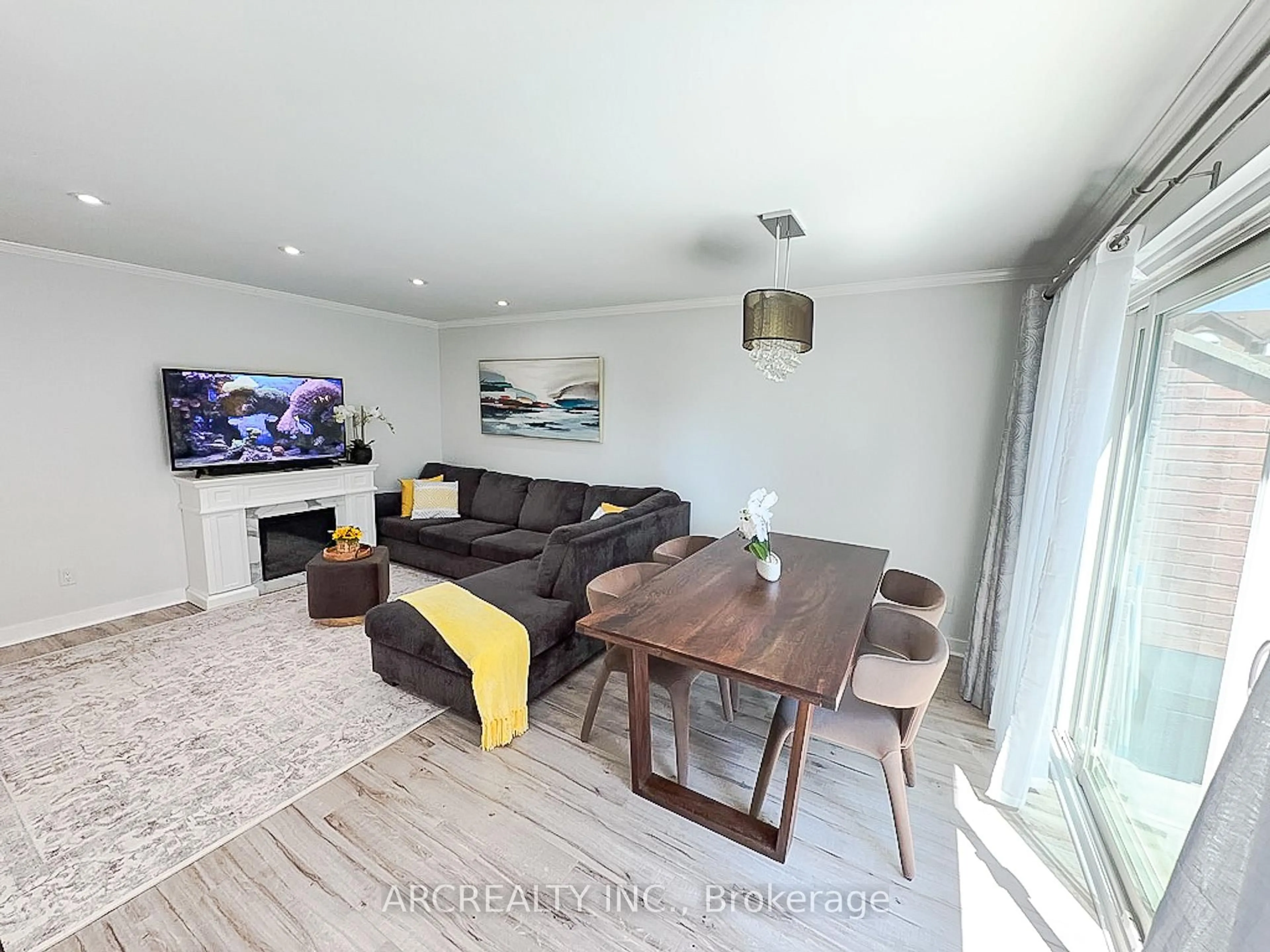 Living room with furniture, wood/laminate floor for 87 Irwin Rd #1, Toronto Ontario M9W 5W1