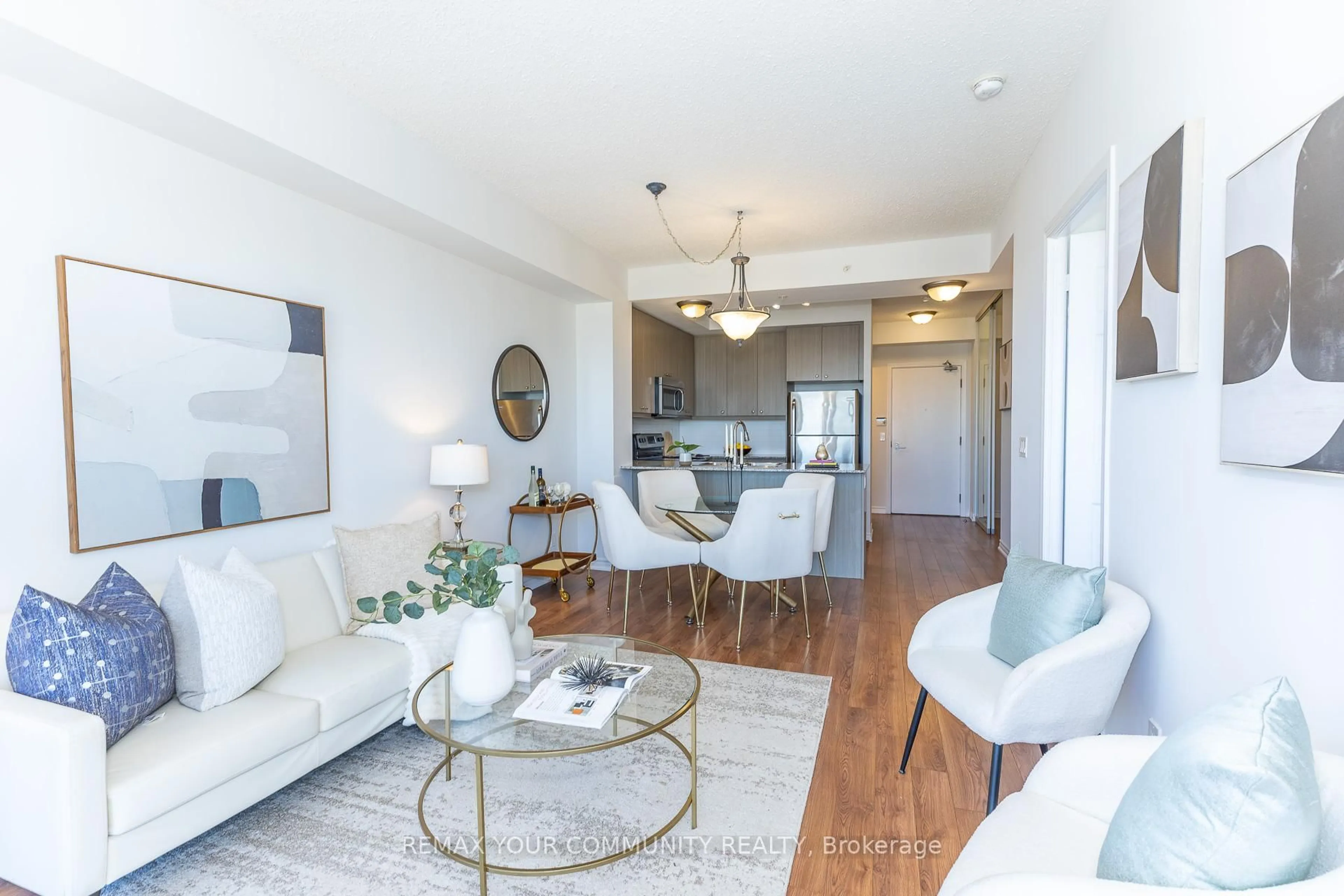 Living room with furniture, wood/laminate floor for 15 James Finlay Way #706, Toronto Ontario M3M 0B3