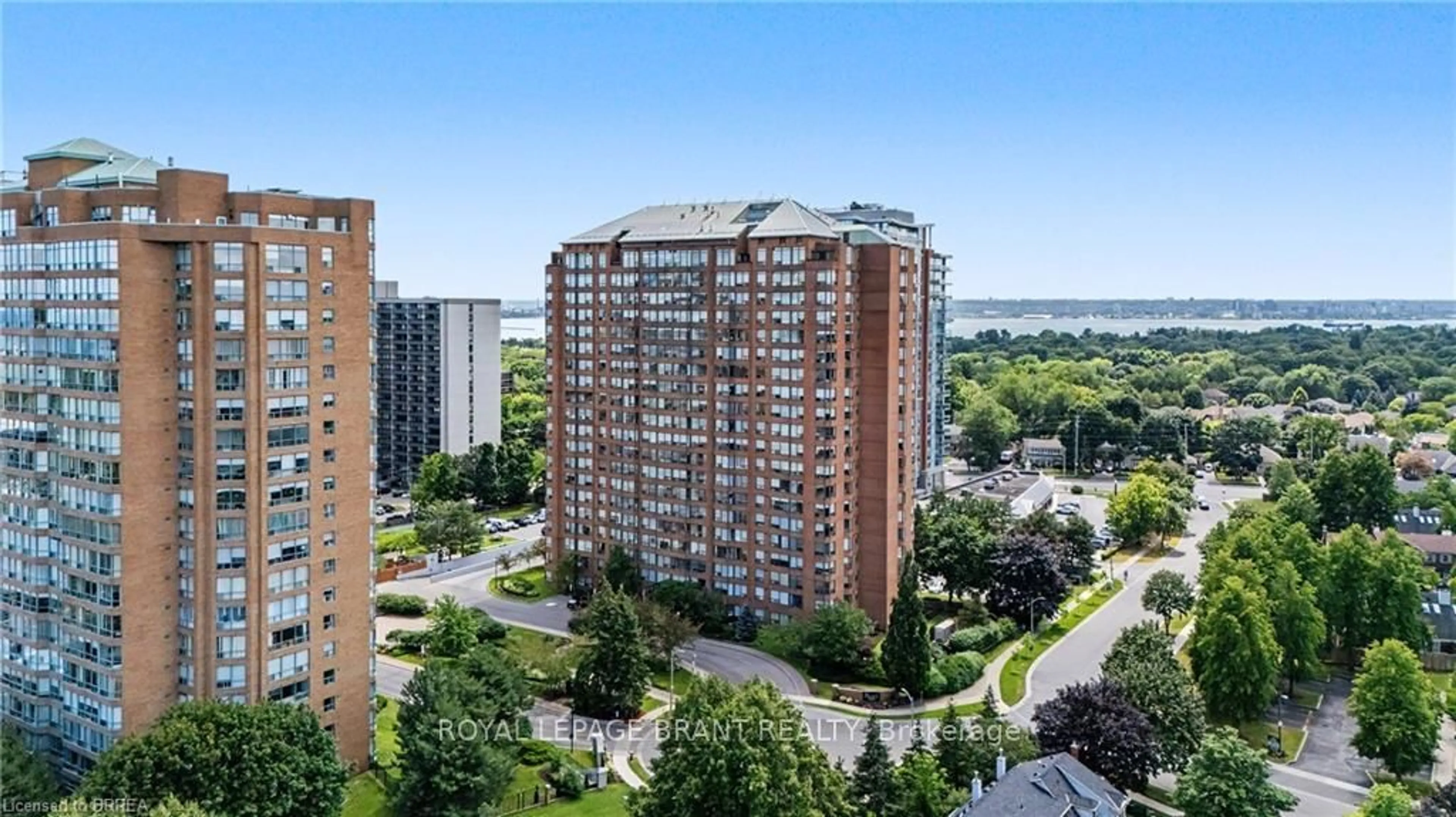 A pic from outside/outdoor area/front of a property/back of a property/a pic from drone, city buildings view from balcony for 1270 Maple Crossing Blvd #204, Burlington Ontario L7S 2J3