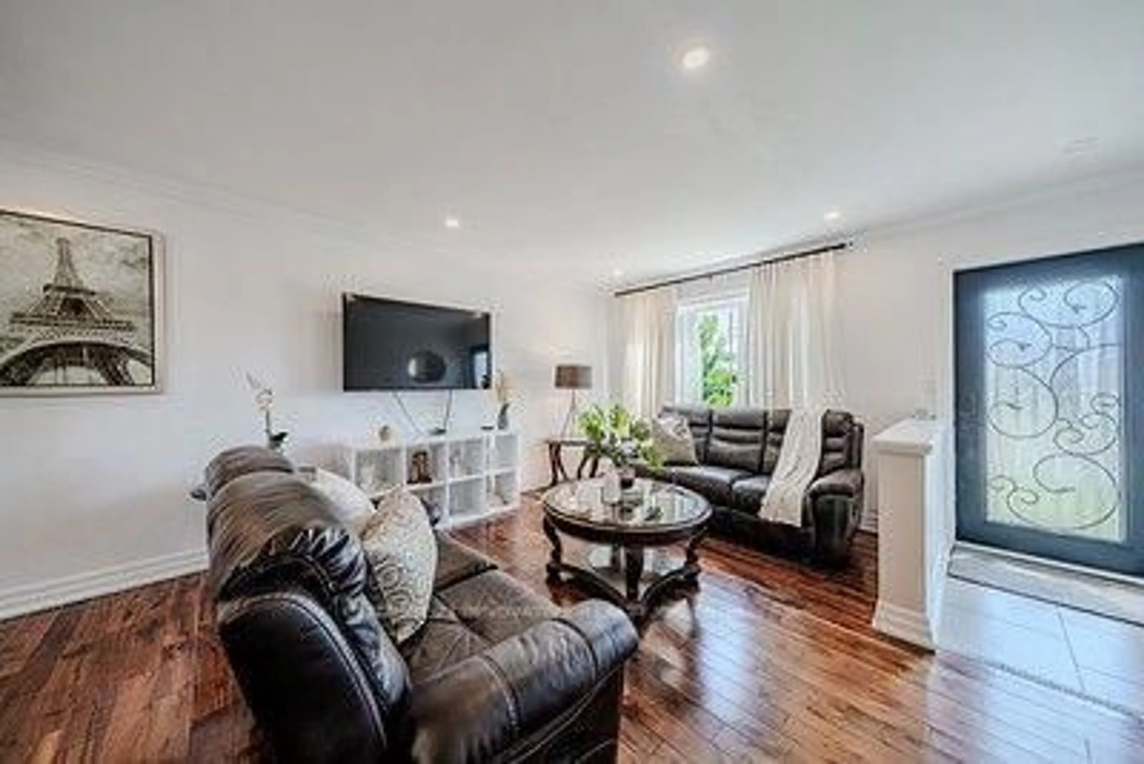 Living room with furniture, wood/laminate floor for 60 Dorking Cres, Toronto Ontario M3M 2B6