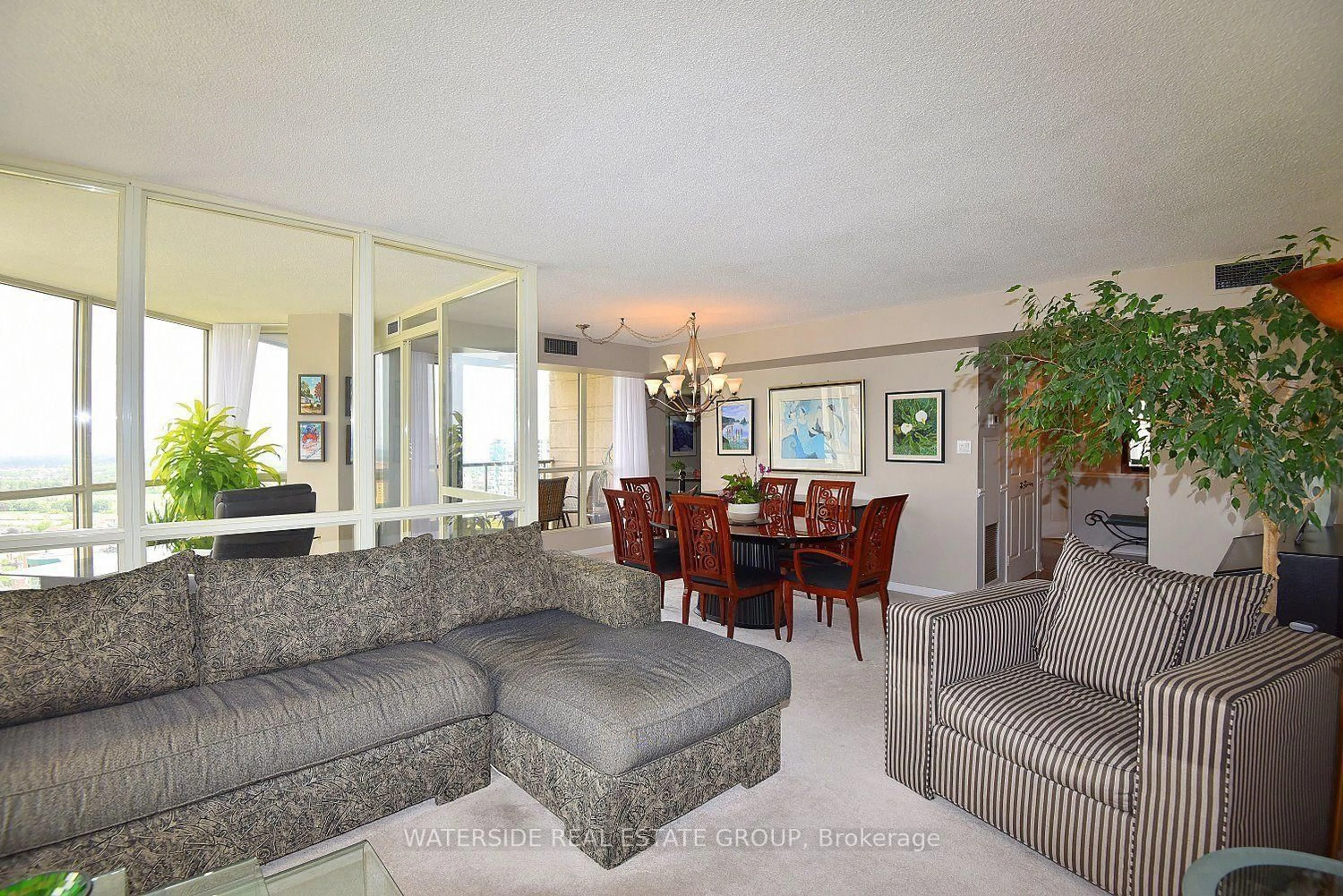 Living room with furniture, unknown for 55 Kingsbridge Garden Circ #2210, Mississauga Ontario L5R 1Y1