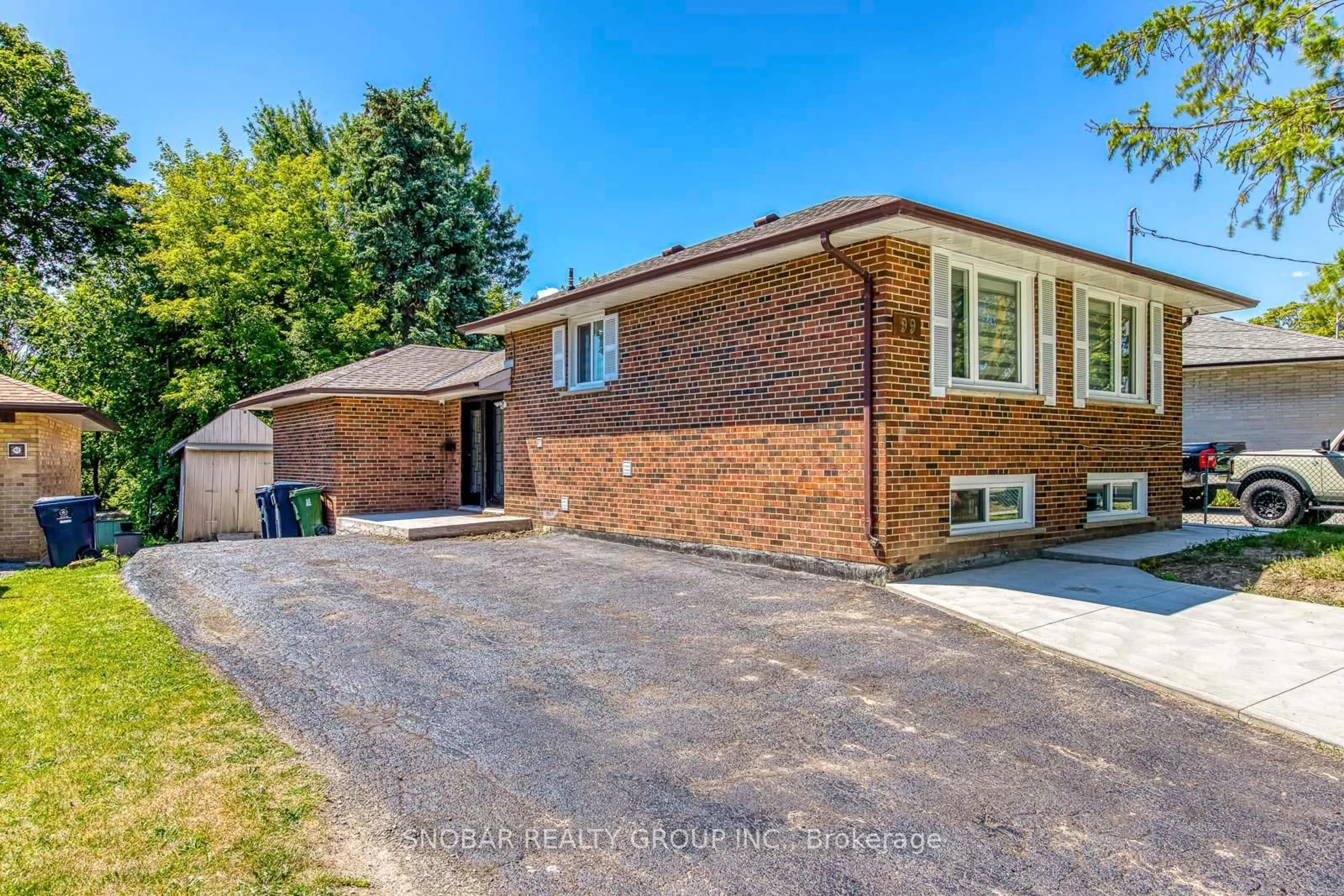 Home with brick exterior material, street for 99 Jeffcoat Dr, Toronto Ontario M9W 3B9