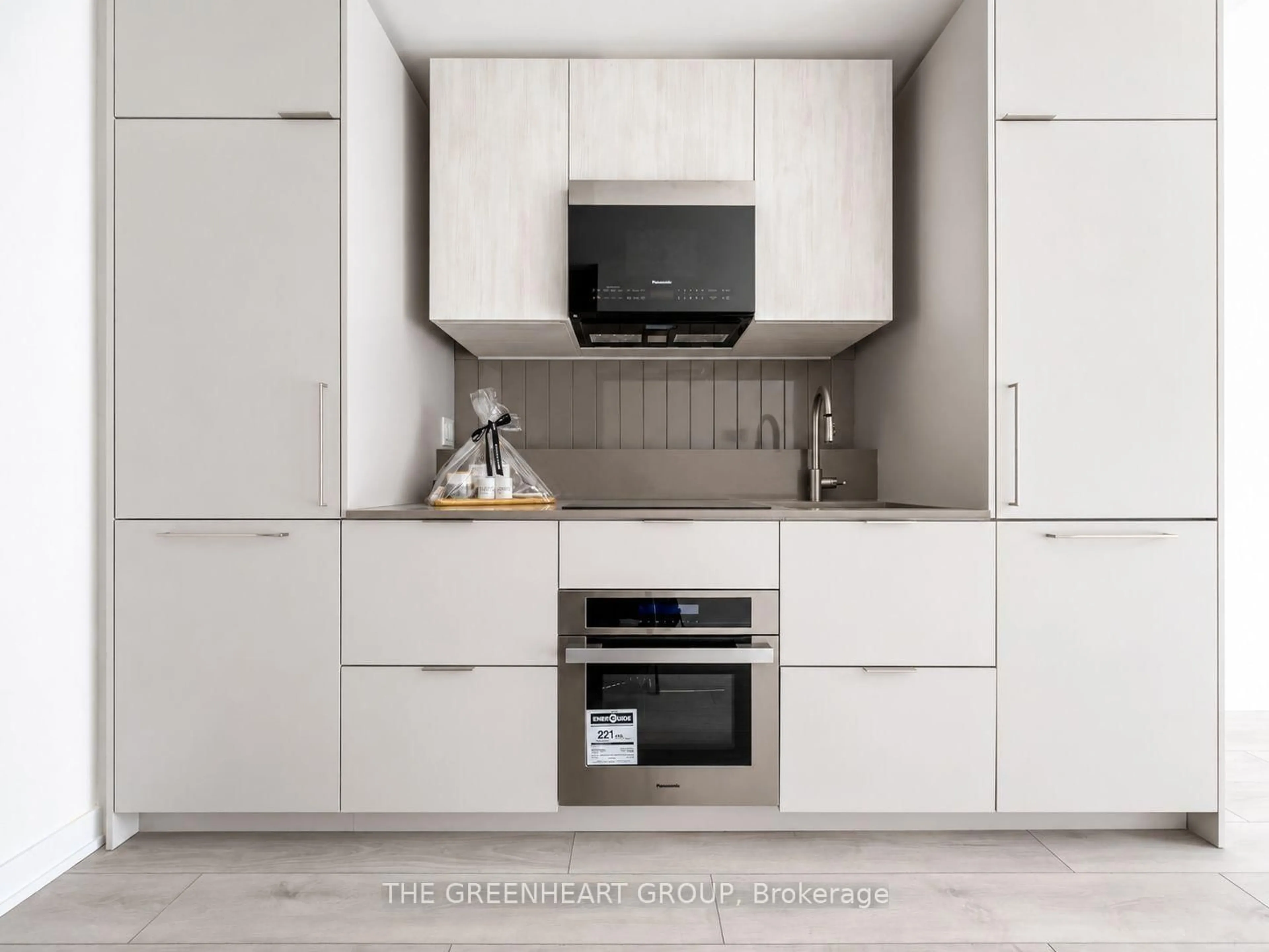 Contemporary kitchen, wood/laminate floor for 1 Fairview Rd #609, Mississauga Ontario L5A 0B4