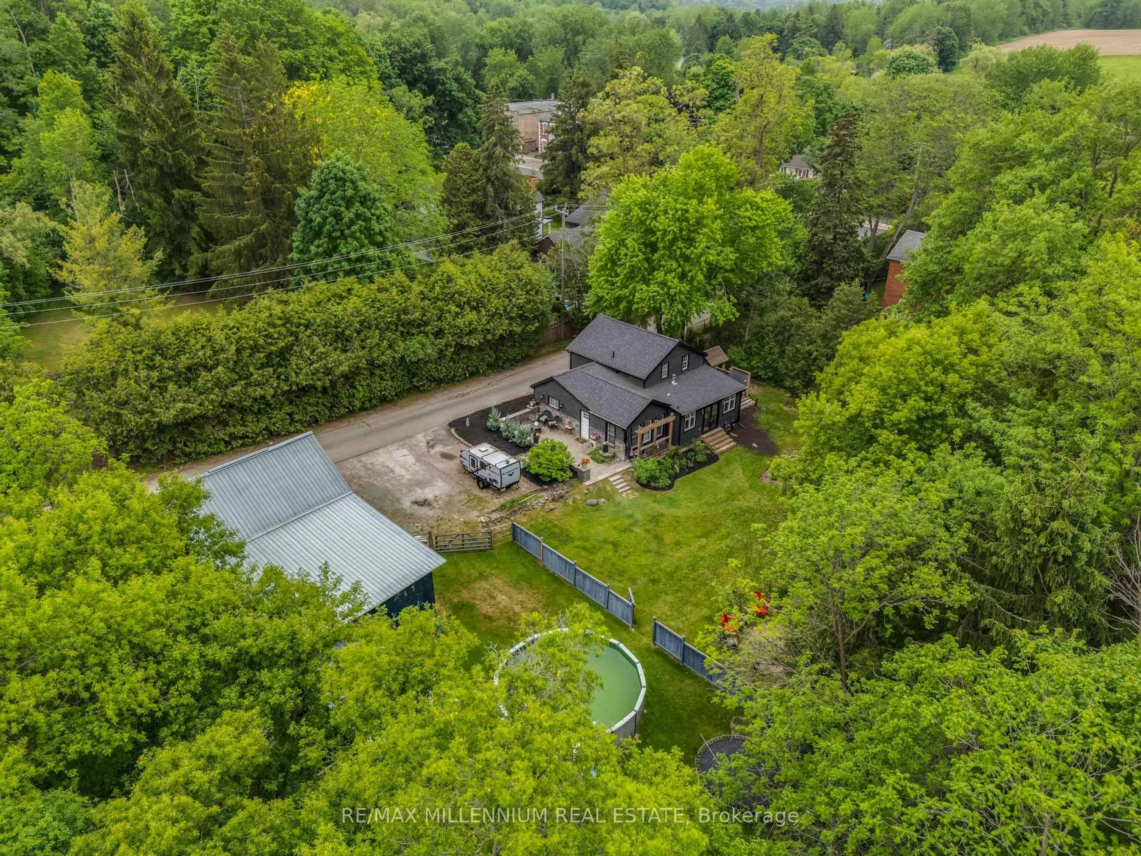 A pic from outside/outdoor area/front of a property/back of a property/a pic from drone, forest/trees view for 1510 Station Rd, Caledon Ontario L7C 3M2