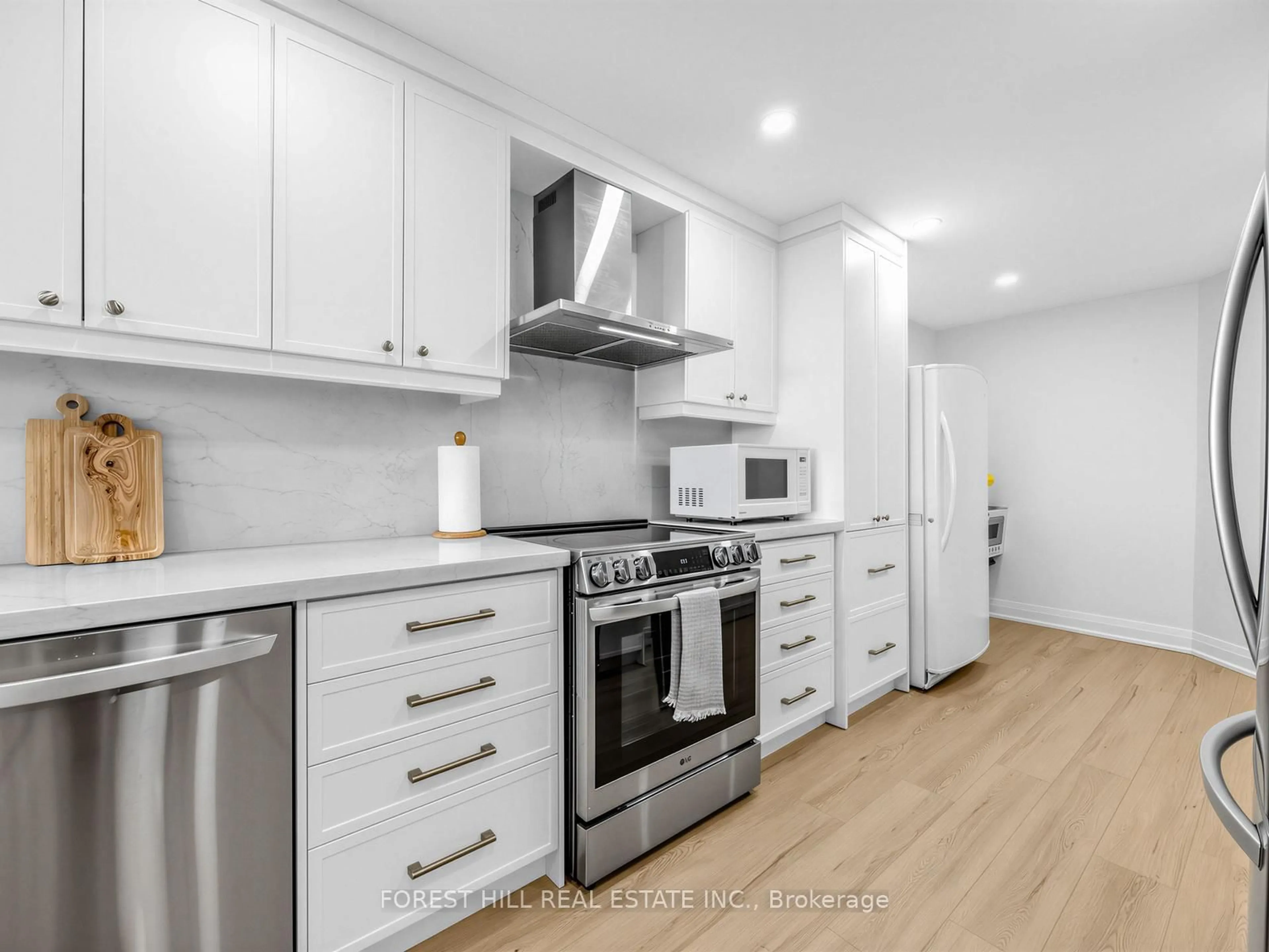 Open concept kitchen, wood/laminate floor for 236 Albion Rd #1812, Toronto Ontario M9W 6A6