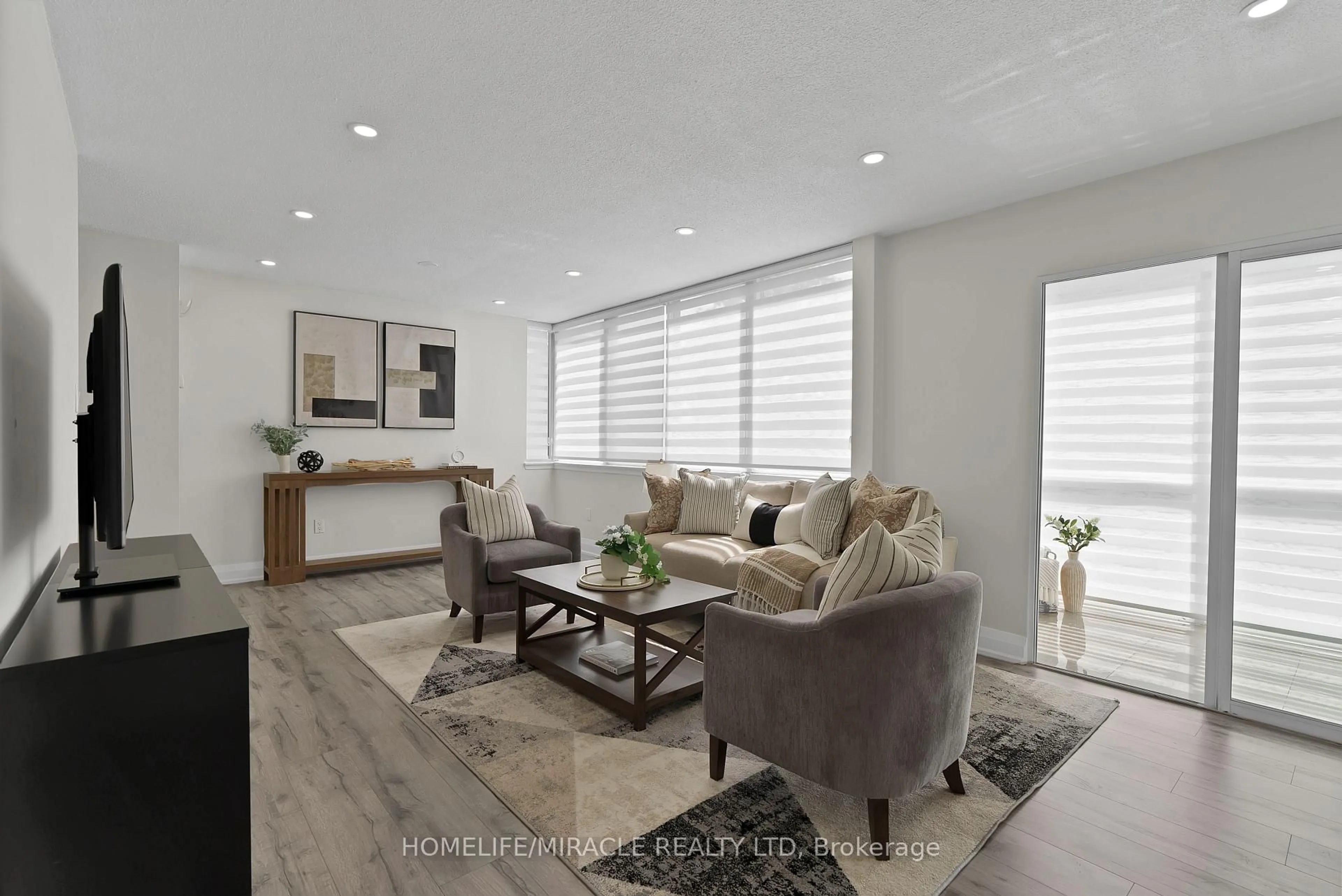 Living room with furniture, unknown for 350 Webb Dr #112, Mississauga Ontario L5B 3W4