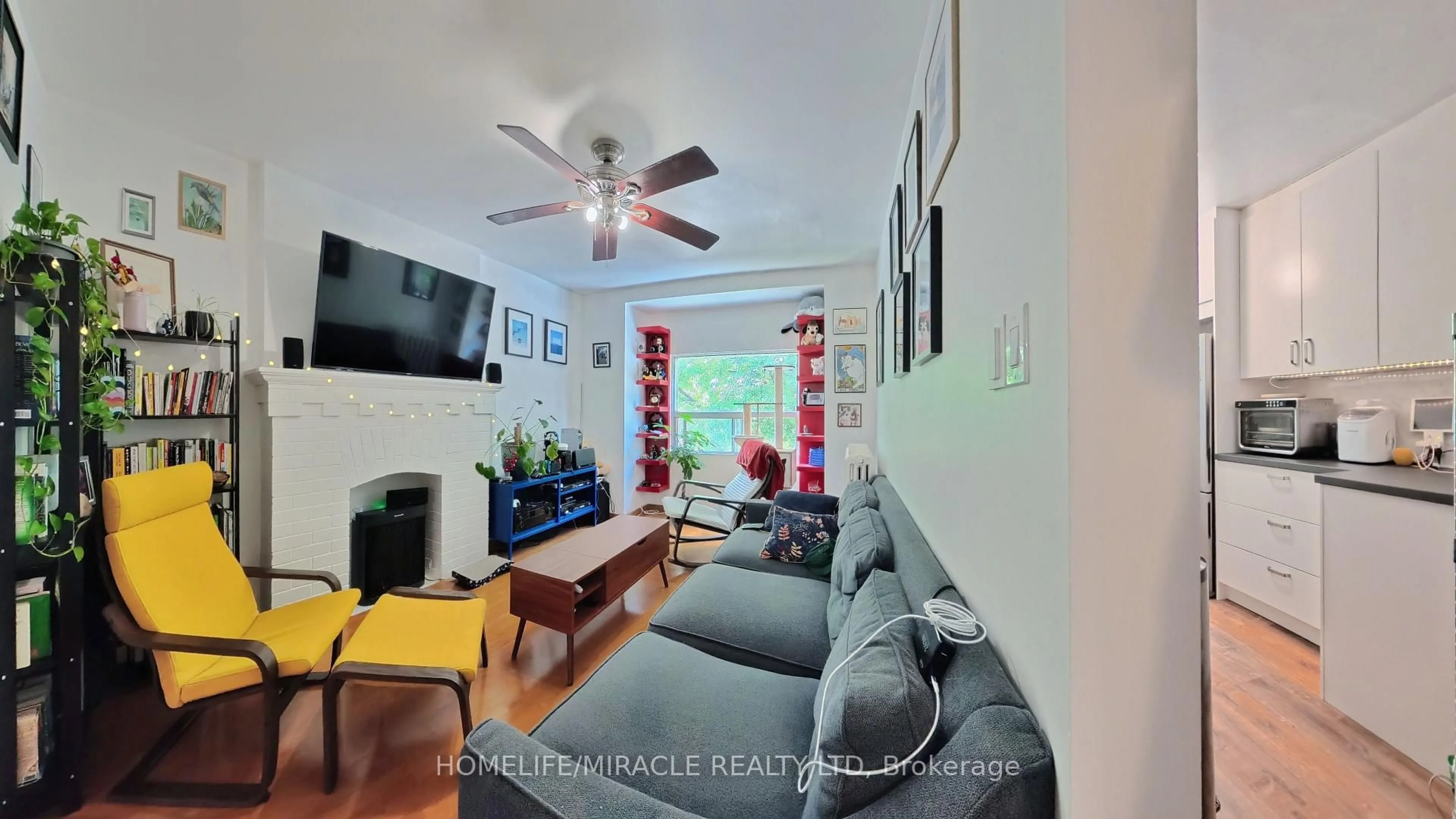 Living room with furniture, wood/laminate floor for 121 Medland St, Toronto Ontario M6P 2N4