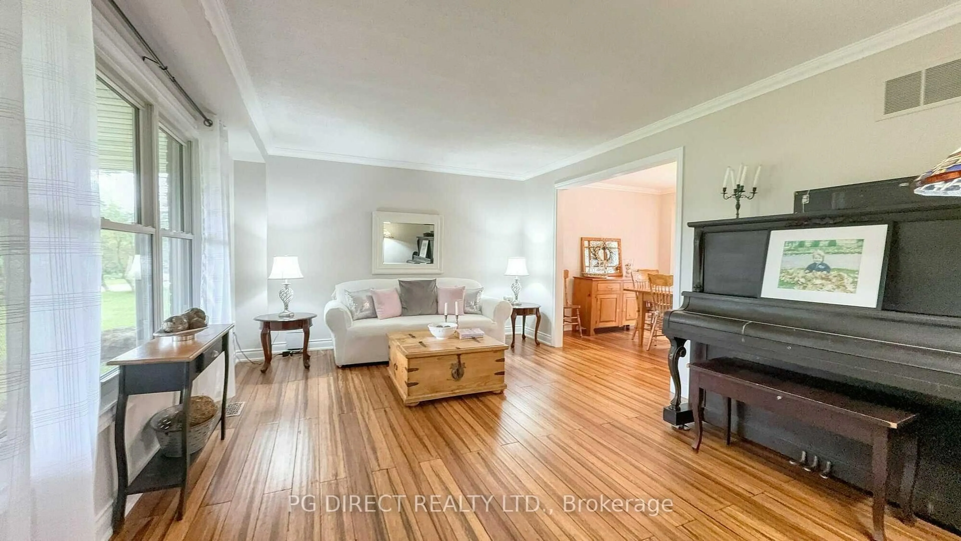Living room with furniture, wood/laminate floor for 12 Meadow Dr, Caledon Ontario L7K 1A3