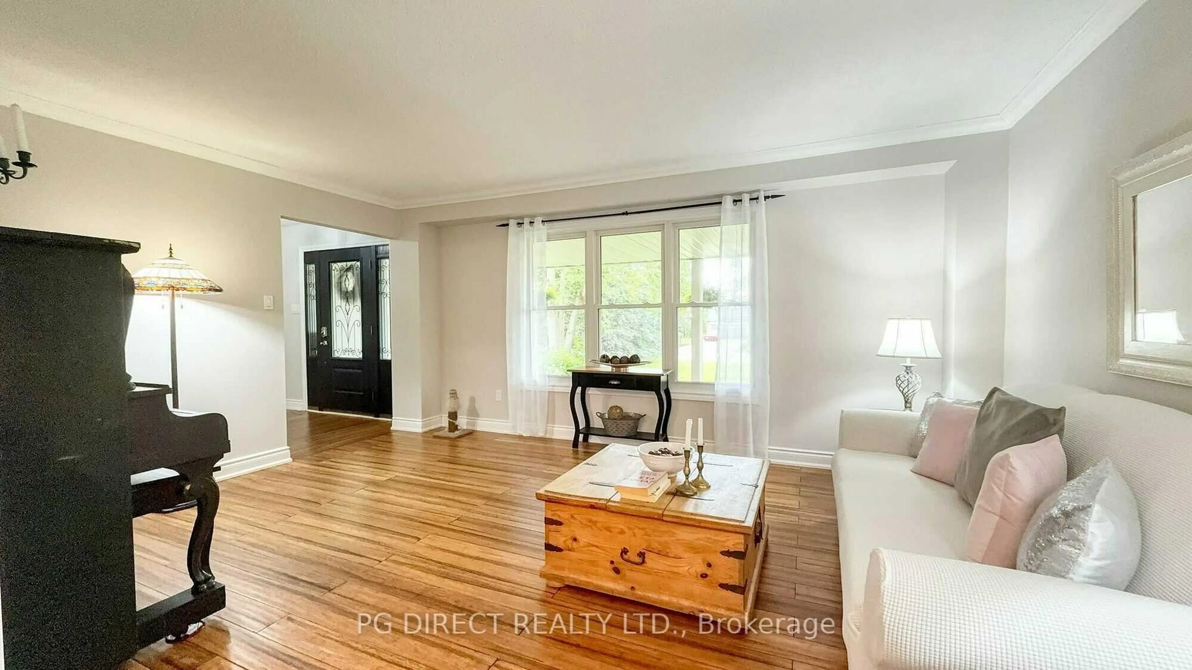 Living room with furniture, wood/laminate floor for 12 Meadow Dr, Caledon Ontario L7K 1A3