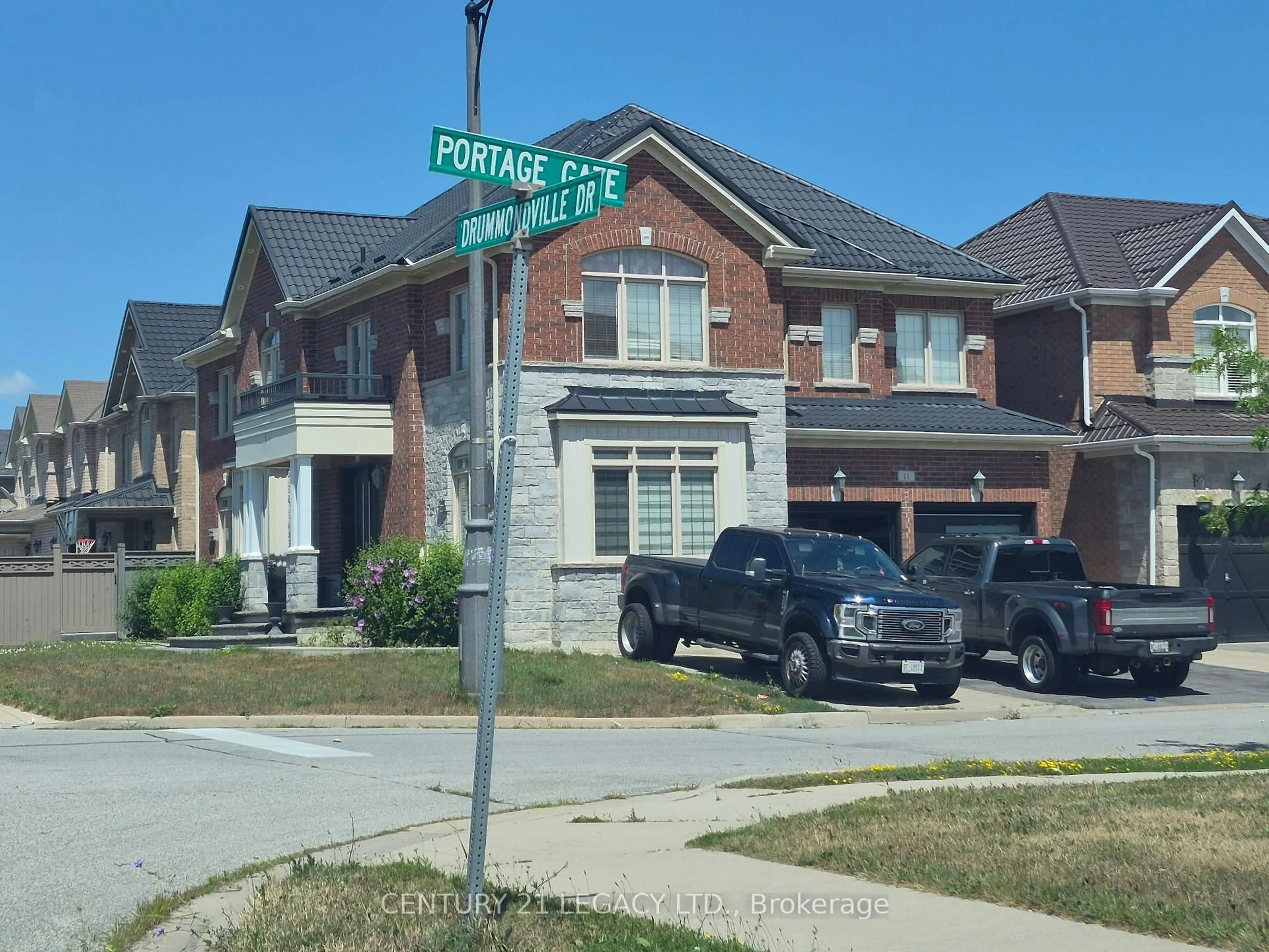 Home with brick exterior material, street for 11 DRUMMONDVILLE Dr, Brampton Ontario L6P 3M6