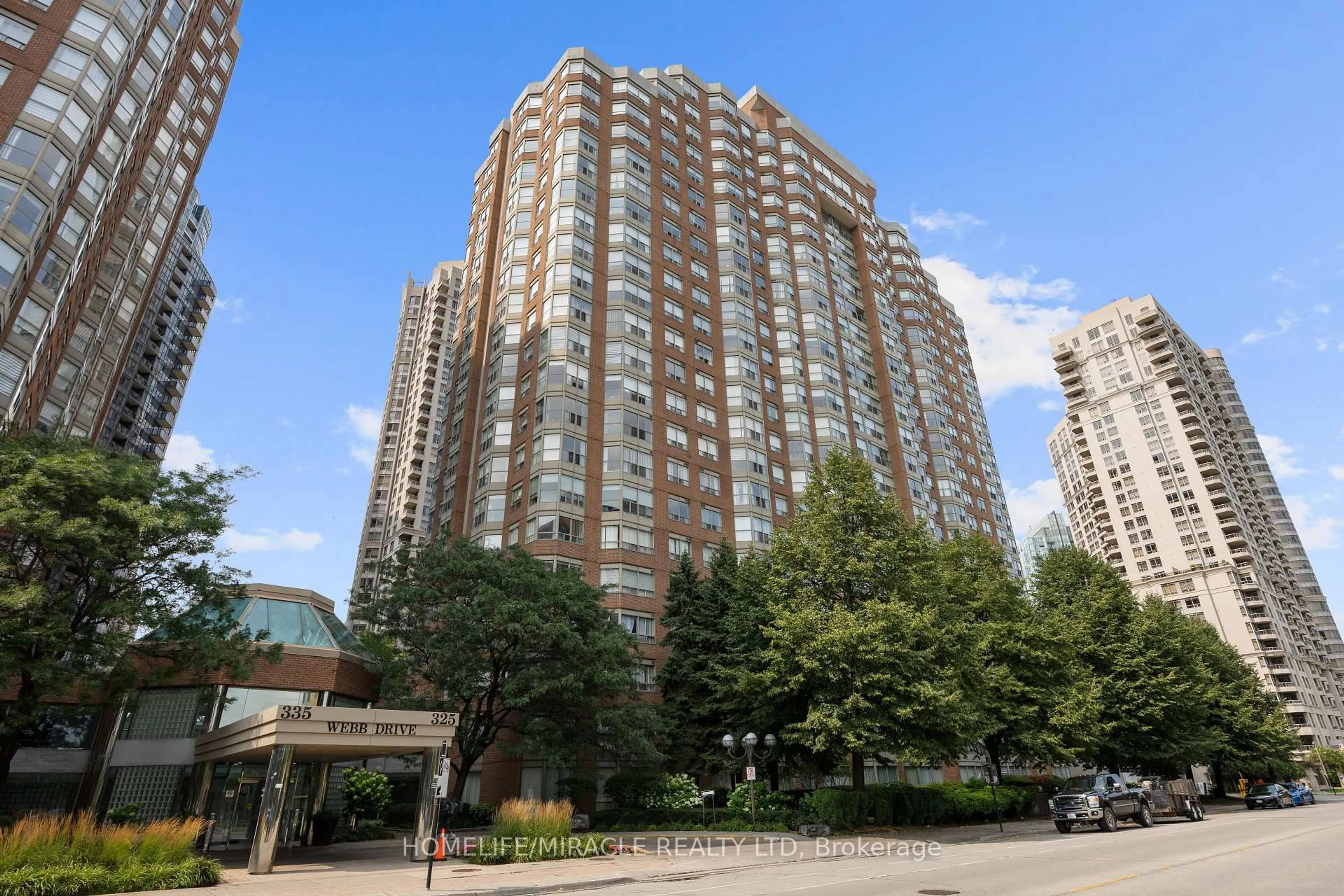 Patio, city buildings view from balcony for 325 Webb Dr #406, Mississauga Ontario L5B 3Z9