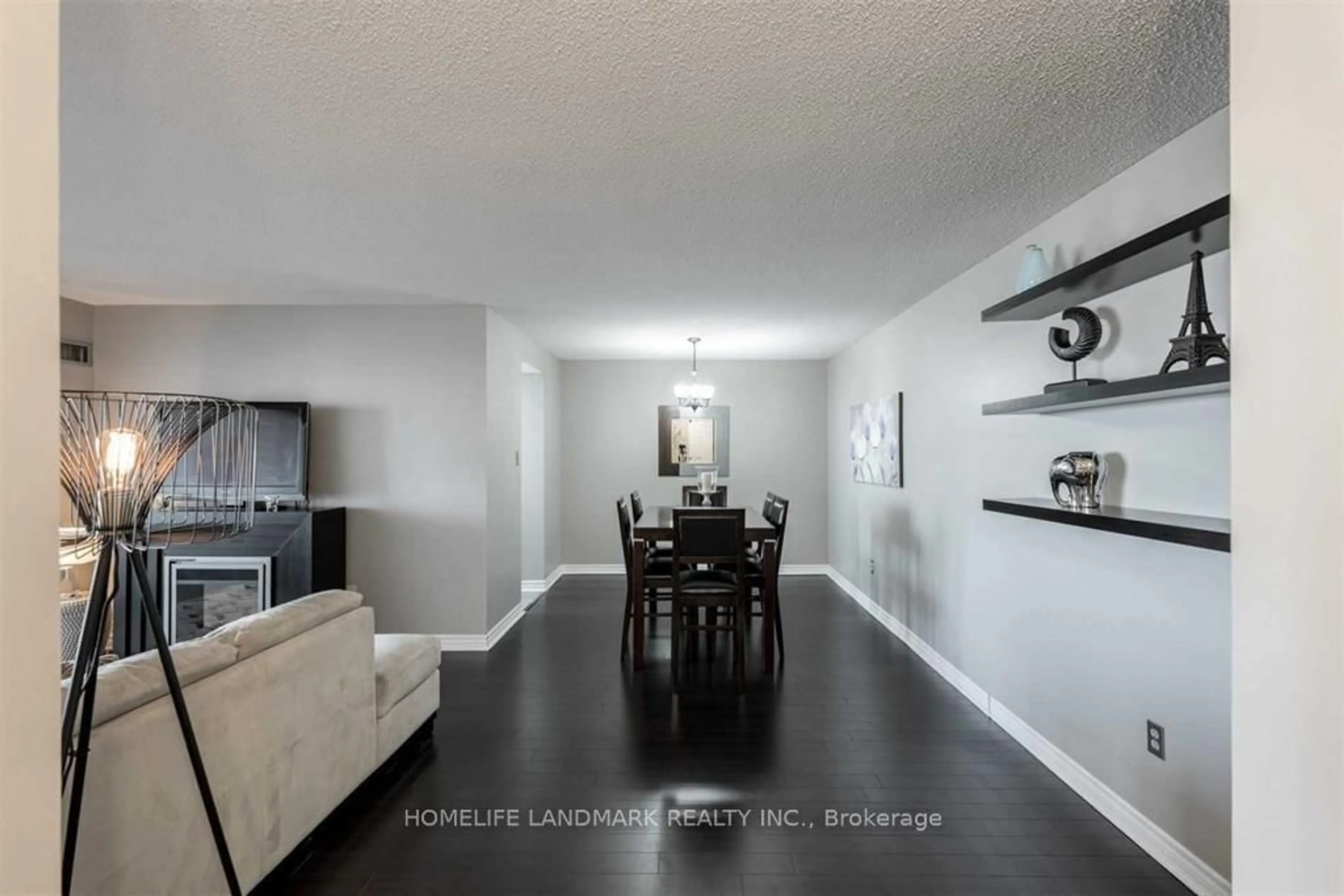 Living room with furniture, wood/laminate floor for 100 County Court Blvd #707, Brampton Ontario L6W 3X1