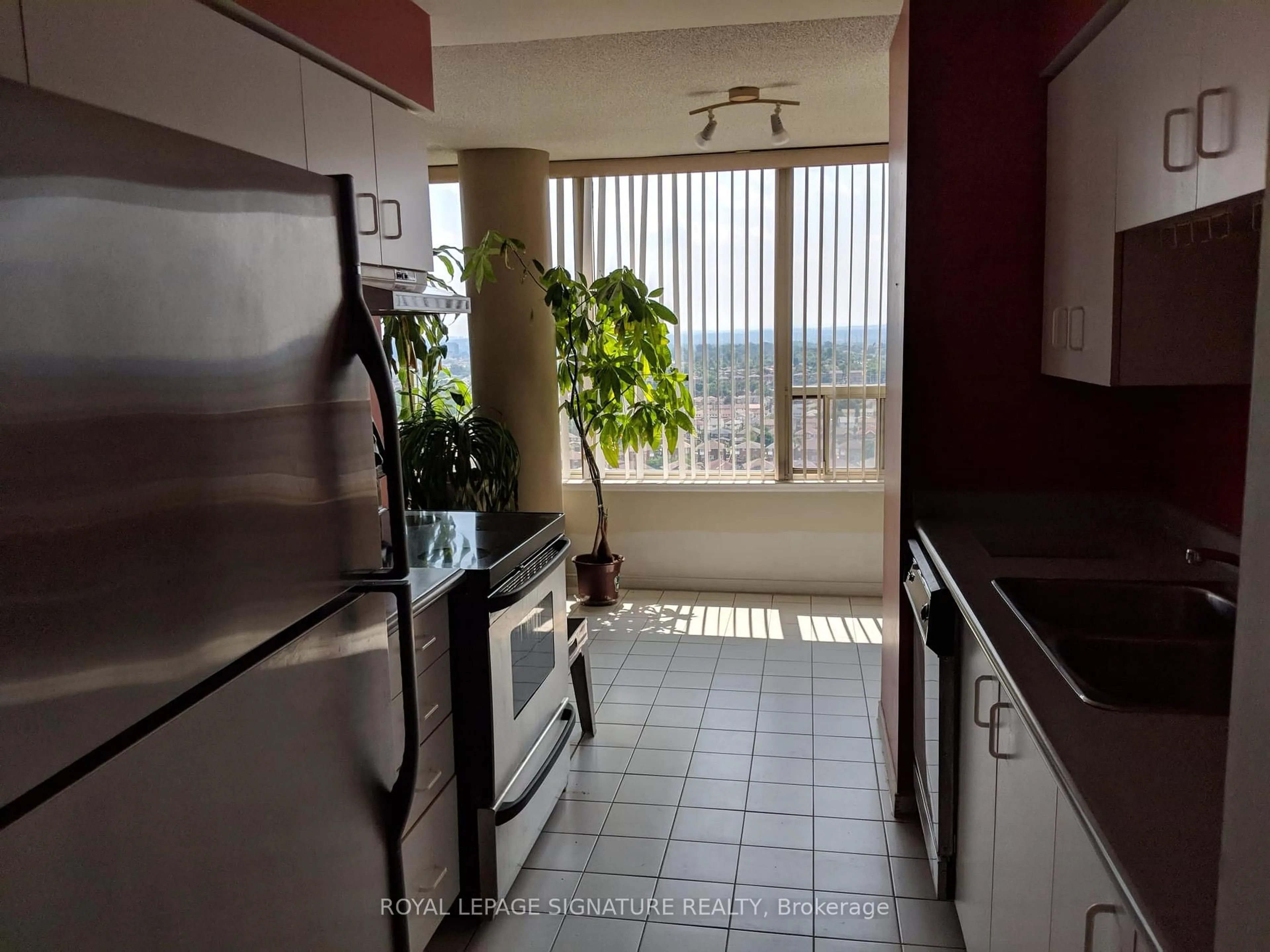 Kitchen with laundary machines, ceramic/tile floor for 330 Rathburn Rd #2209, Mississauga Ontario L5B 3Y1