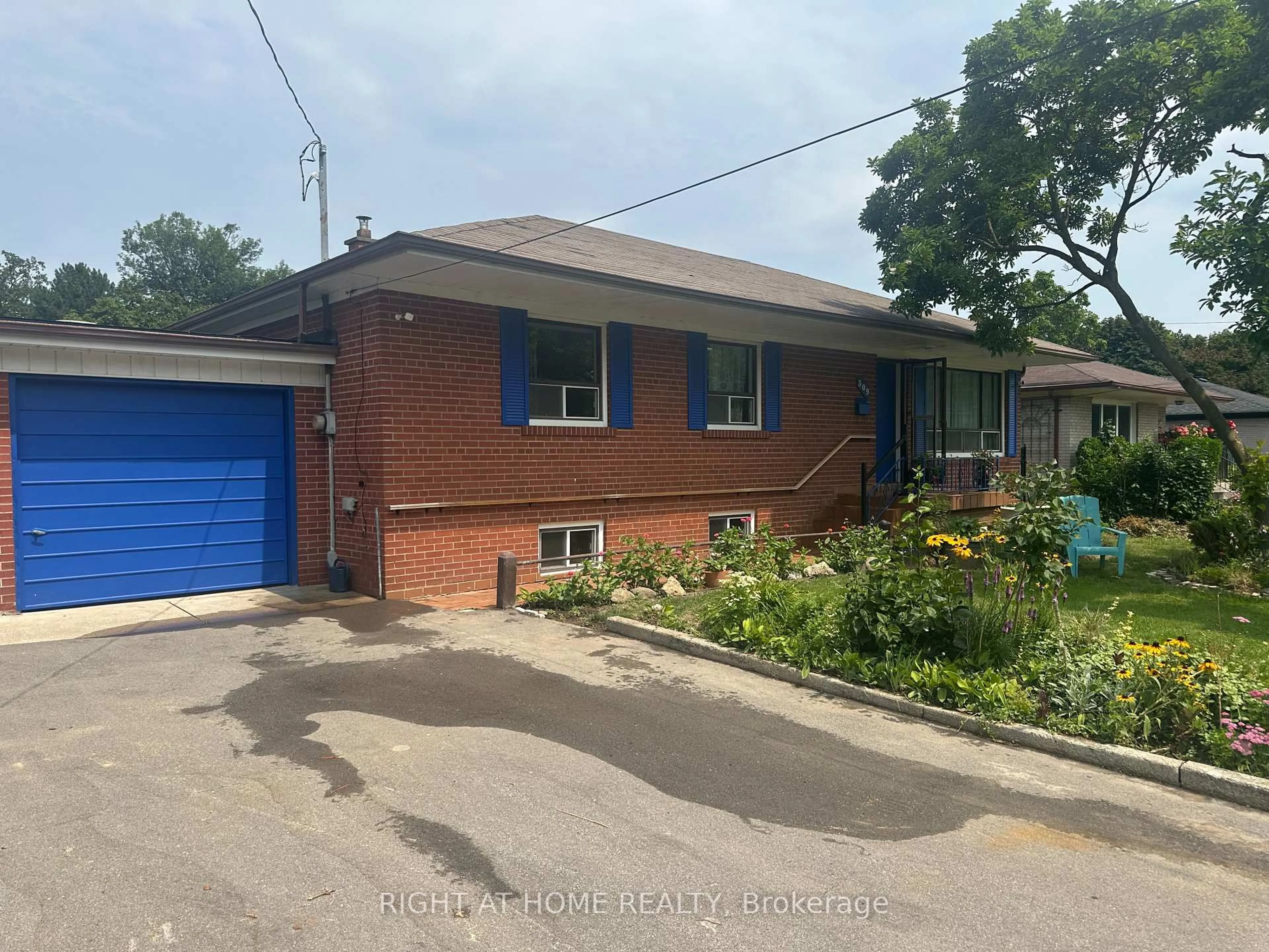 Home with brick exterior material, street for 309 Queen Mary Dr, Oakville Ontario L6K 3L5