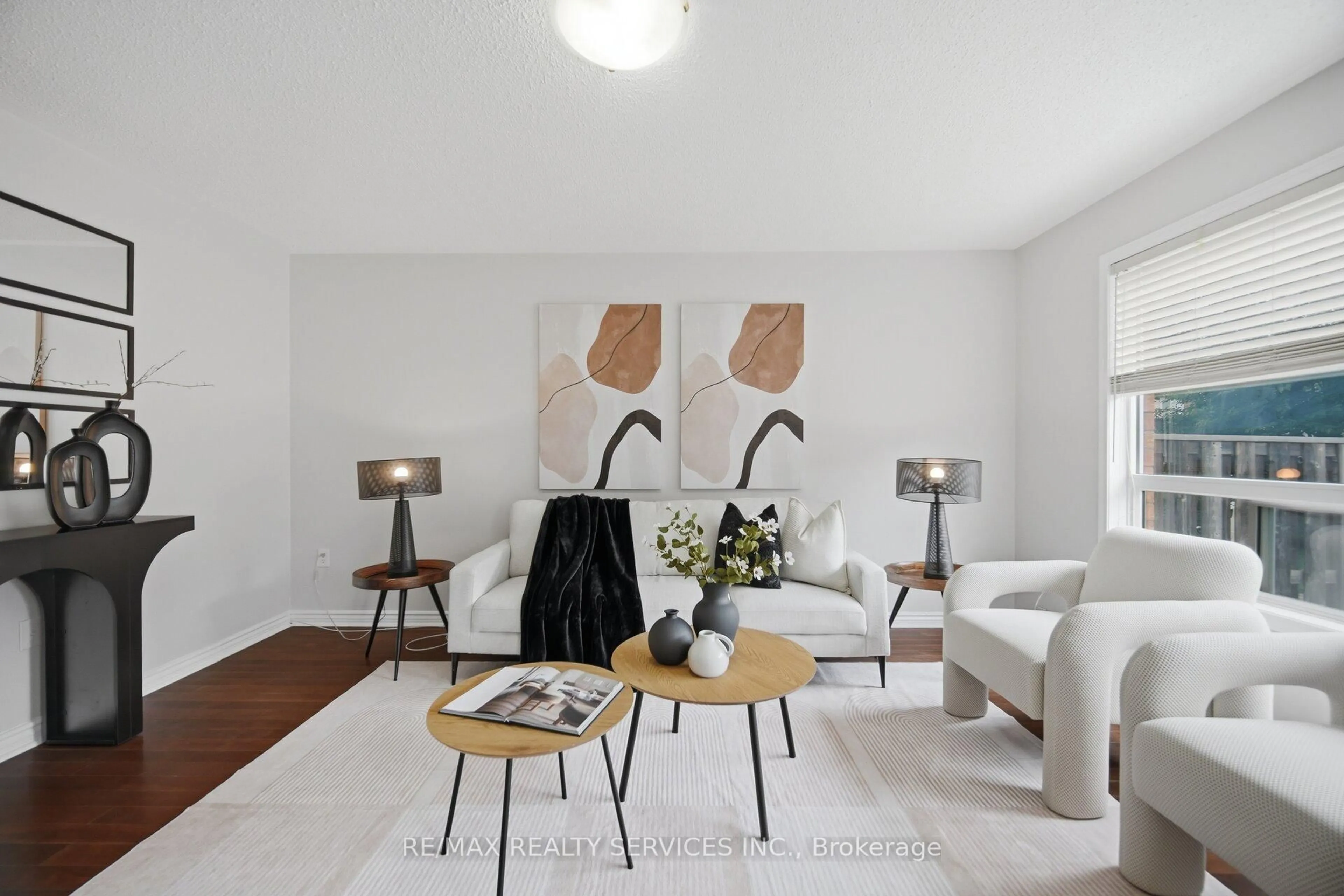 Living room with furniture, wood/laminate floor for 9 Ollie Ave, Brampton Ontario L6X 0M8