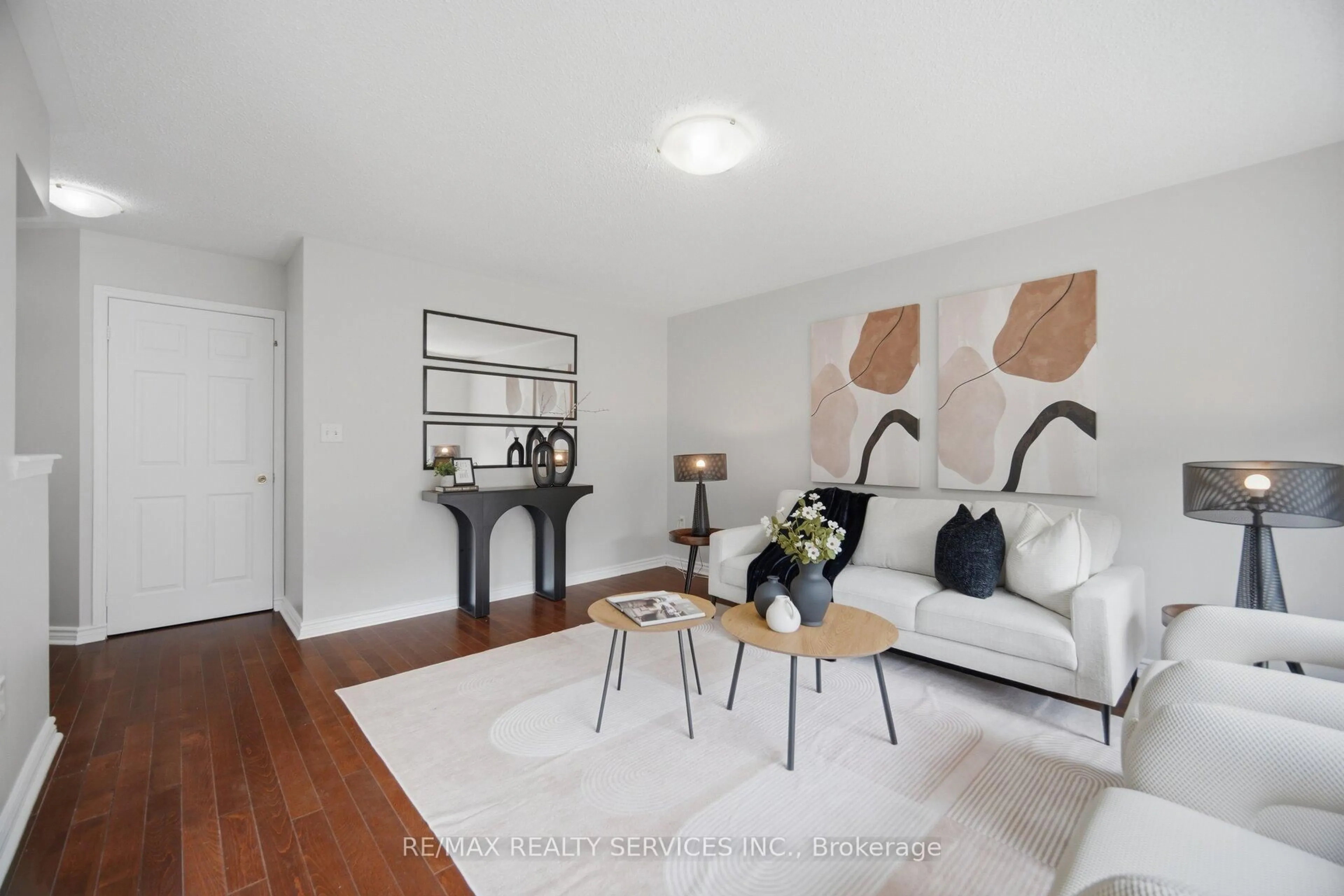 Living room with furniture, wood/laminate floor for 9 Ollie Ave, Brampton Ontario L6X 0M8