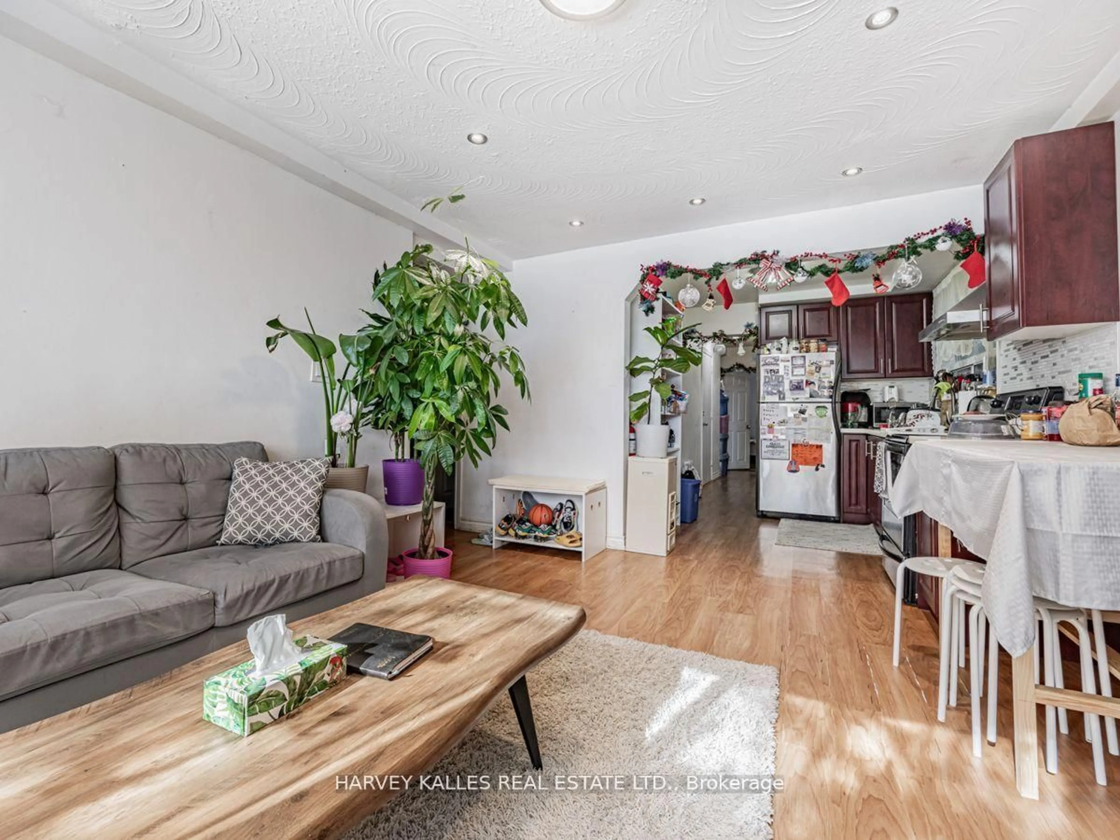 Living room with furniture, wood/laminate floor for 6 Carrington Ave, Toronto Ontario M6E 2C3