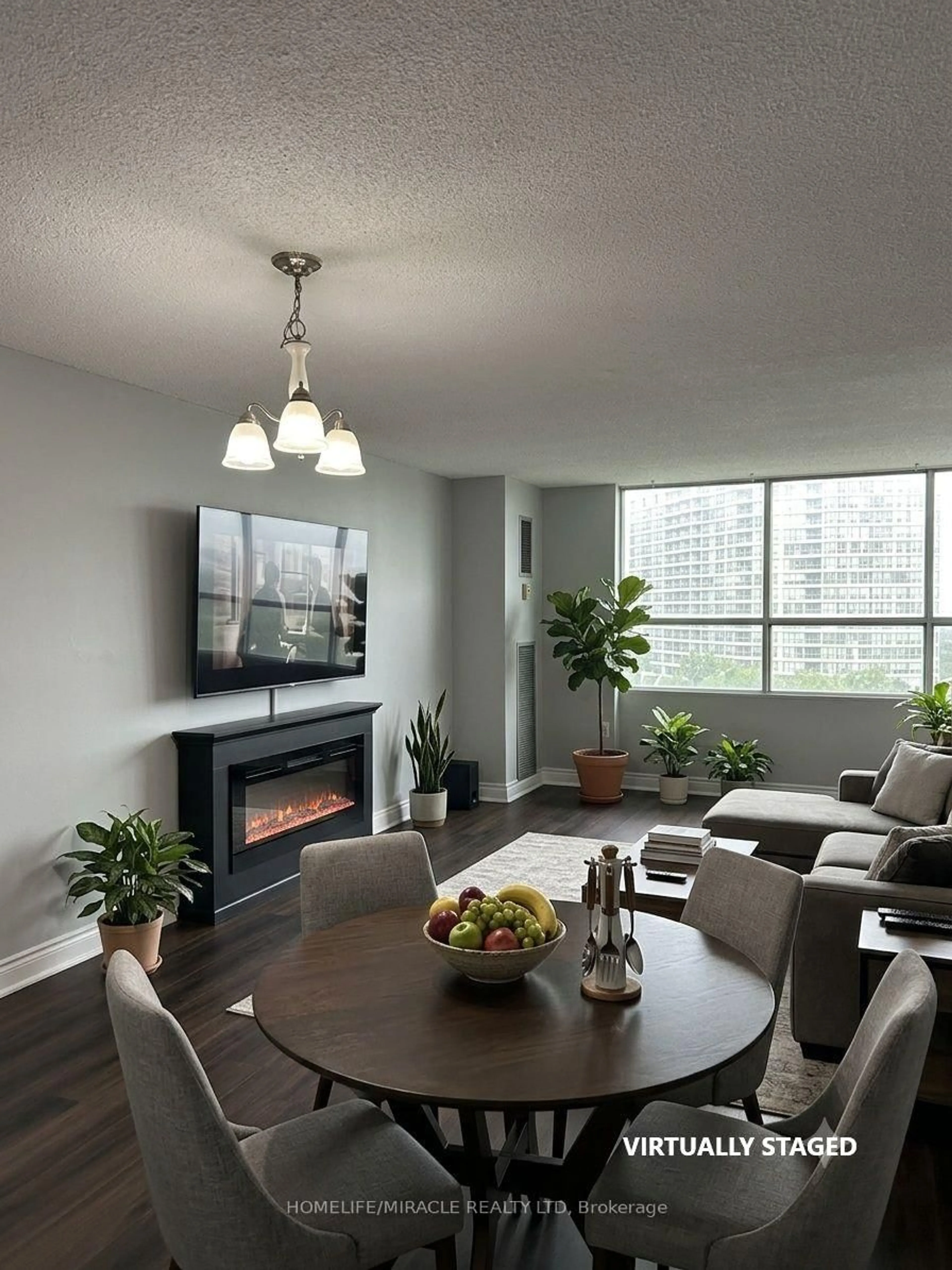 Living room with furniture, wood/laminate floor for 40 Panorama Crt #807, Toronto Ontario M9V 4M1