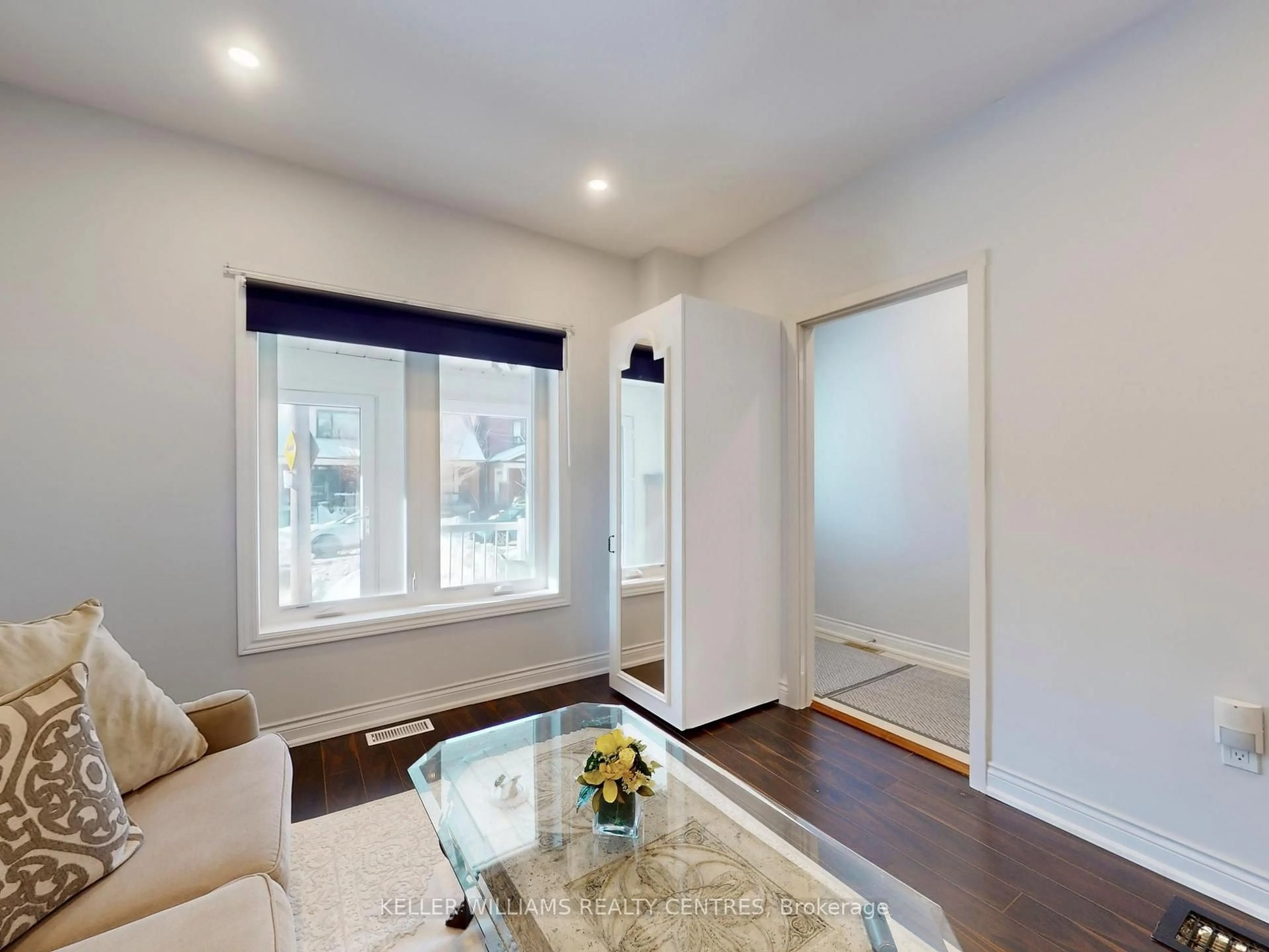 Living room with furniture, wood/laminate floor for 62 Hounslow Heath Rd, Toronto Ontario M6N 1G8