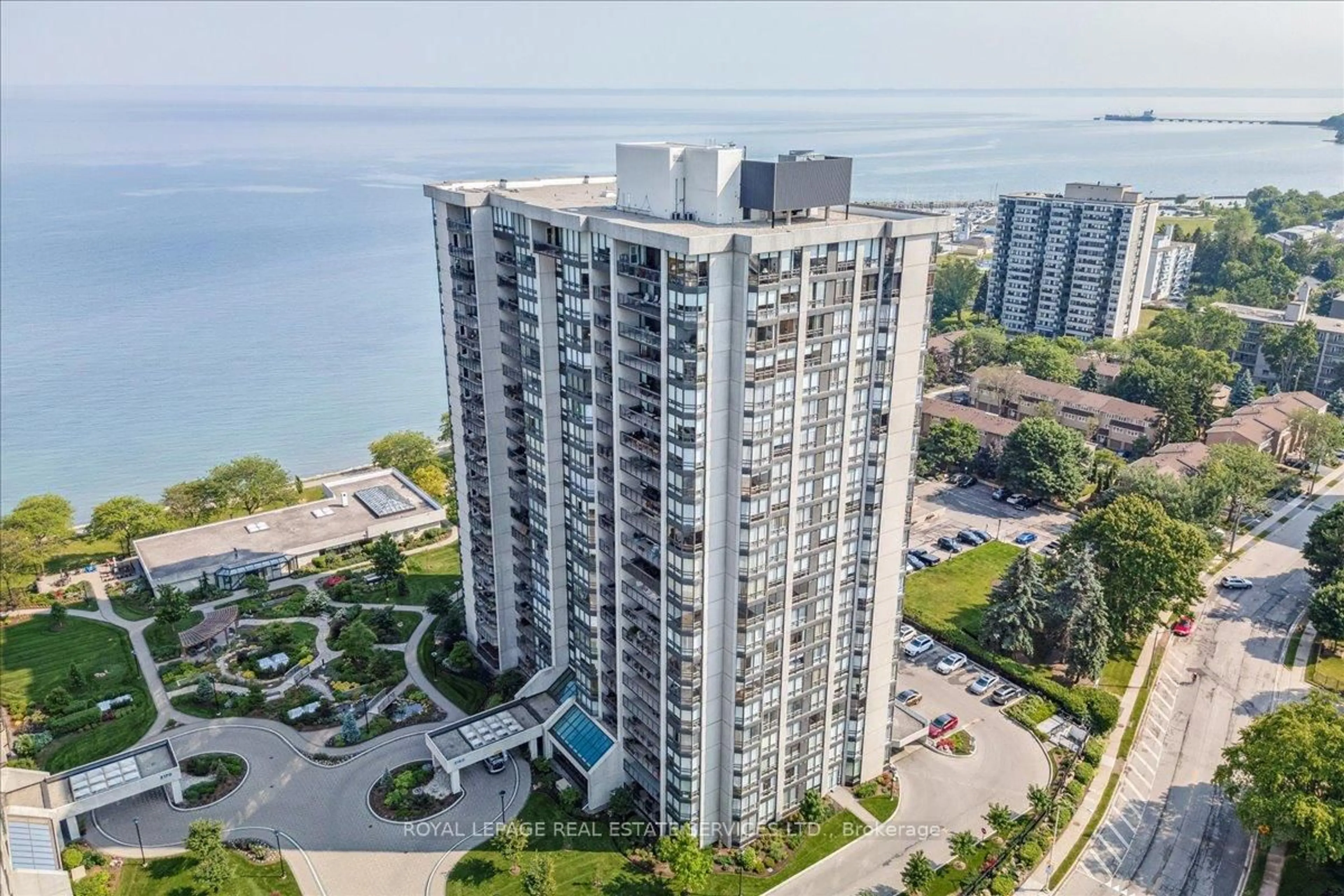 A pic from outside/outdoor area/front of a property/back of a property/a pic from drone, water/lake/river/ocean view for 2180 Marine Dr #1401, Oakville Ontario L6L 5V2