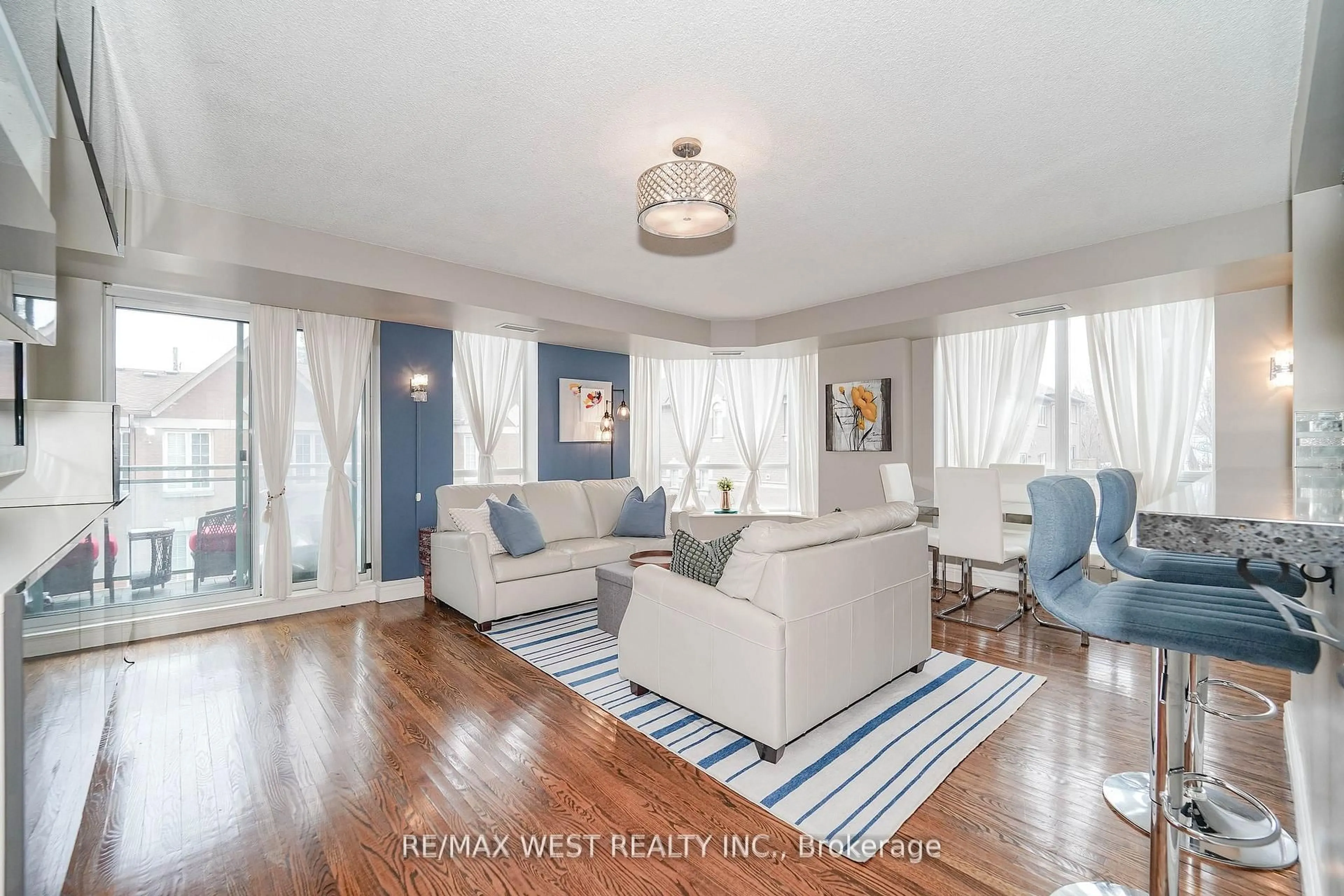 Living room with furniture, wood/laminate floor for 190 Manitoba St #309, Toronto Ontario M8Y 3Y8