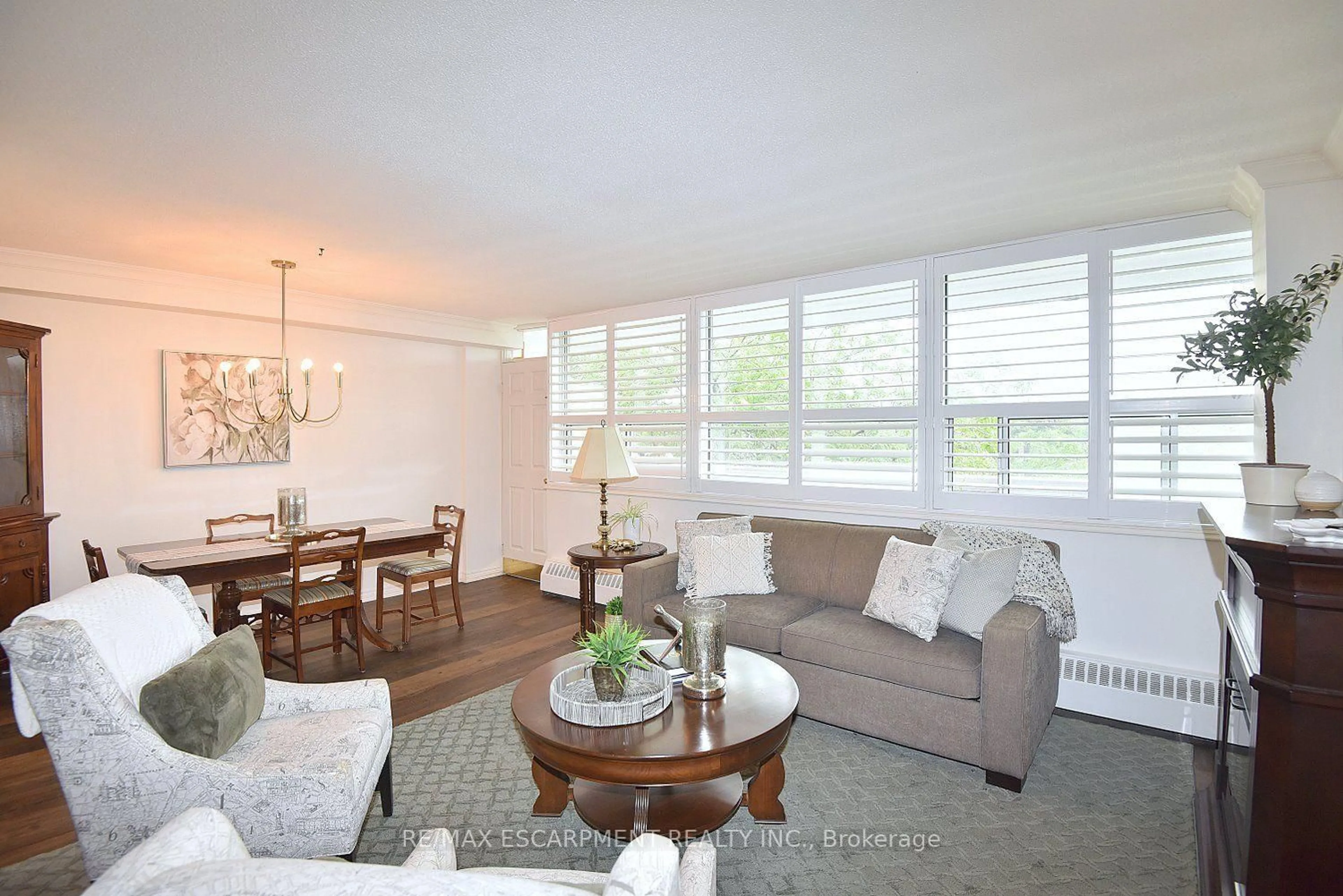Living room with furniture, wood/laminate floor for 2263 Marine Dr #401, Oakville Ontario L6L 5K1