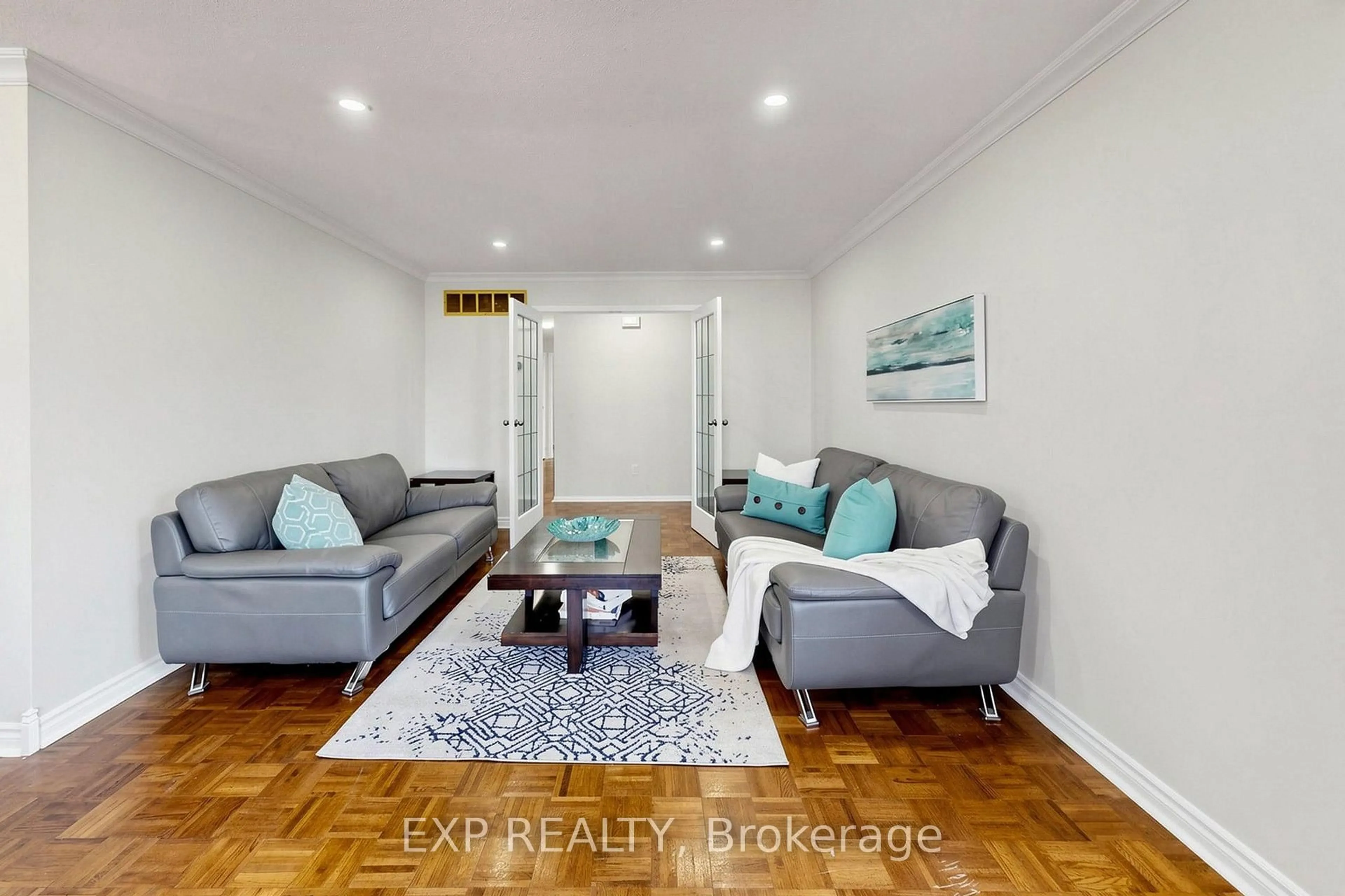 Living room with furniture, wood/laminate floor for 29 Mikado Cres, Brampton Ontario L6S 3R4
